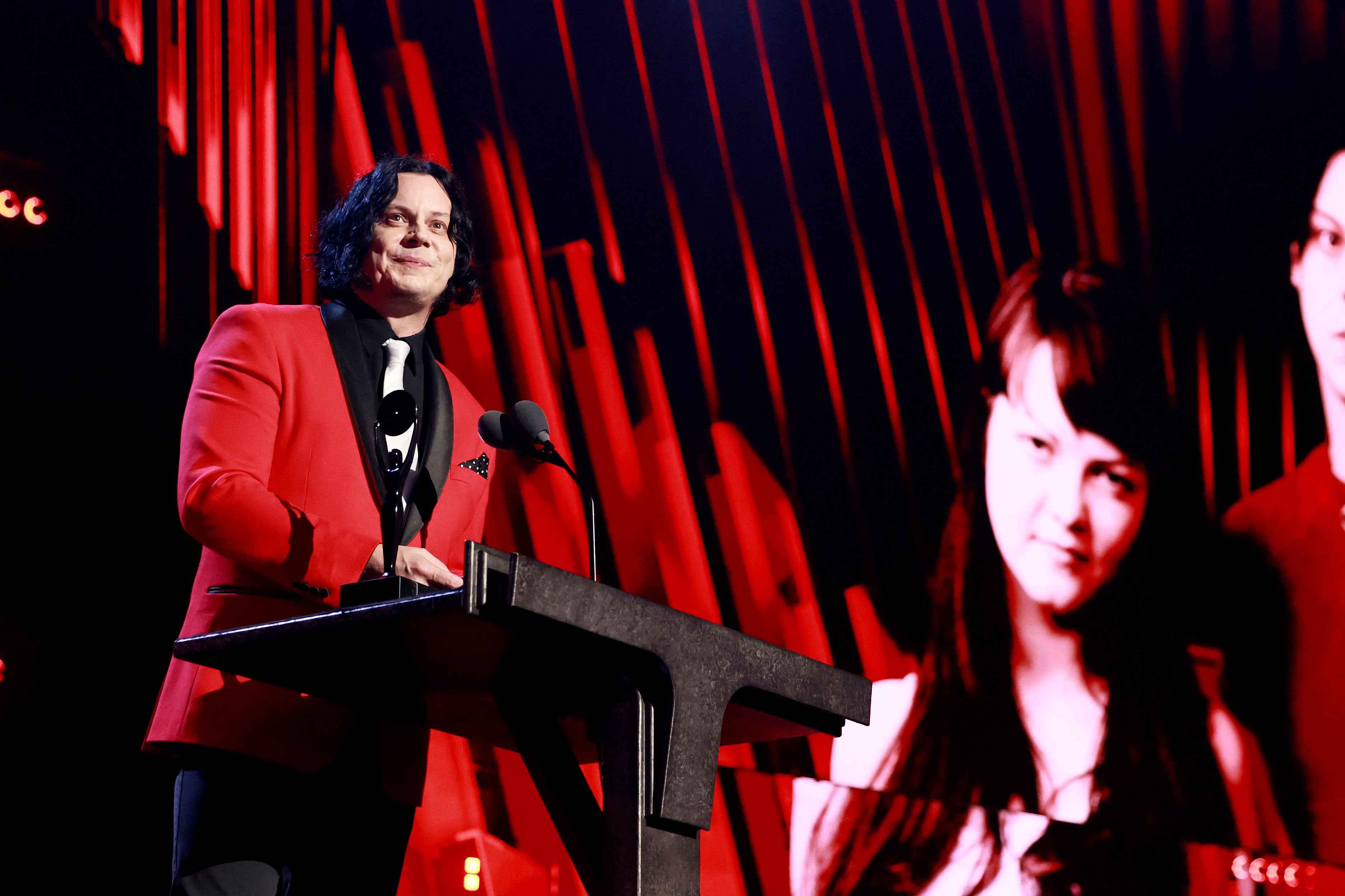 Jack White speaking onstage as the White Stripes are inducted into the Rock & Roll Hall of Fame
