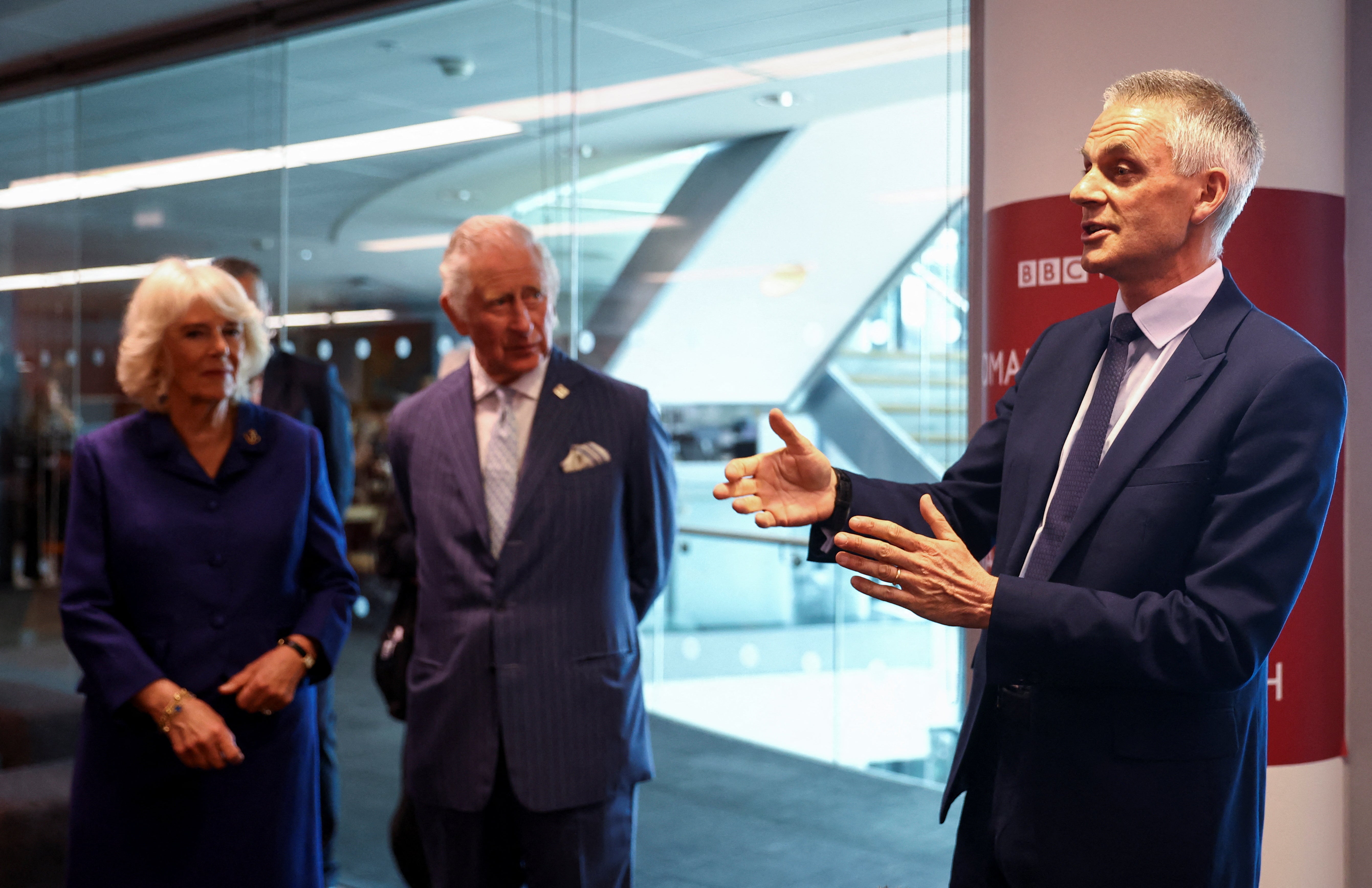 Tim Davie with Charles and Camilla during a visit to the BBC World Service at BBC Broadcasting House in 2022 (PA)