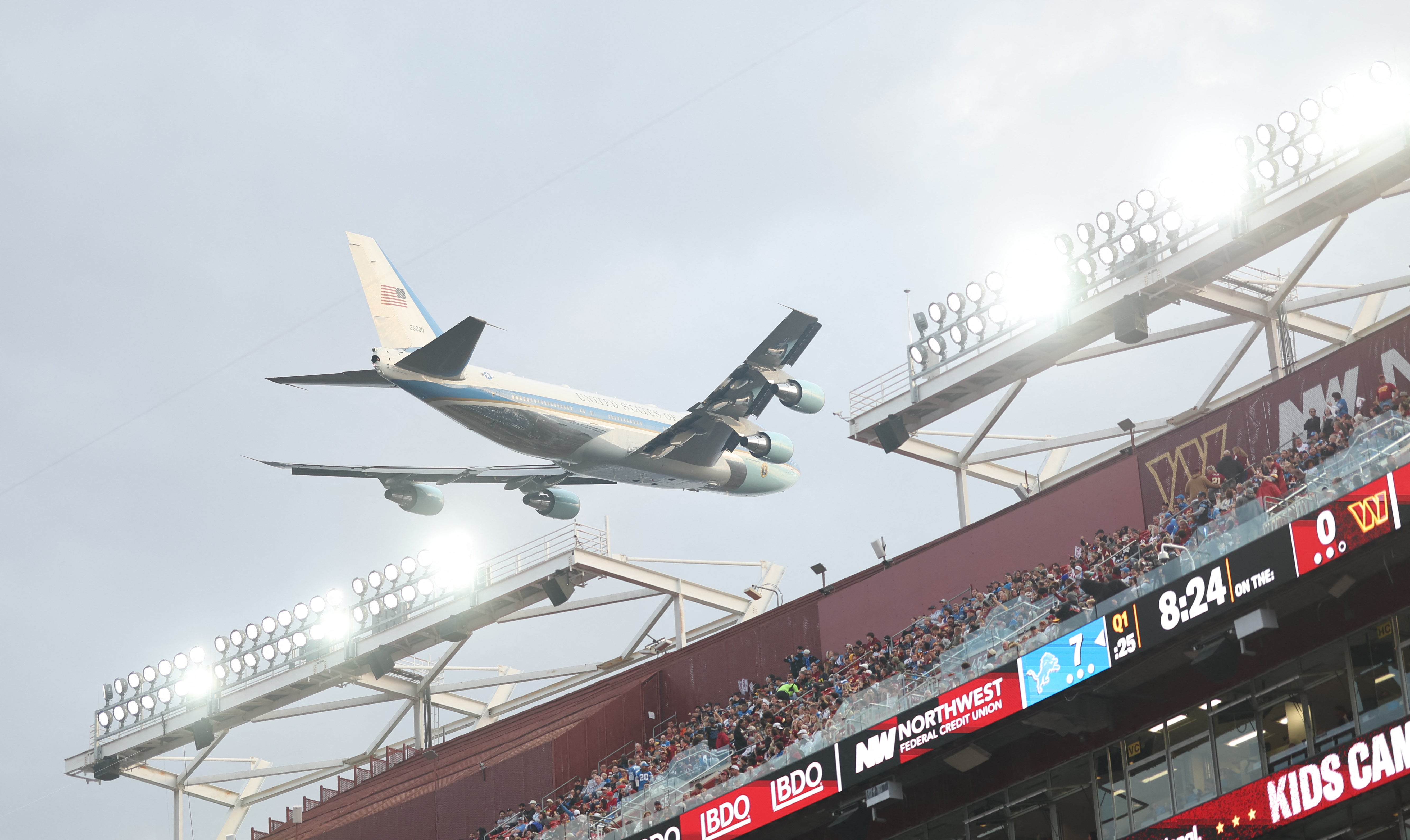 Air Force One flies low over Northwest Stadium during the game between the Washington Commanders and the Detroit Lions.