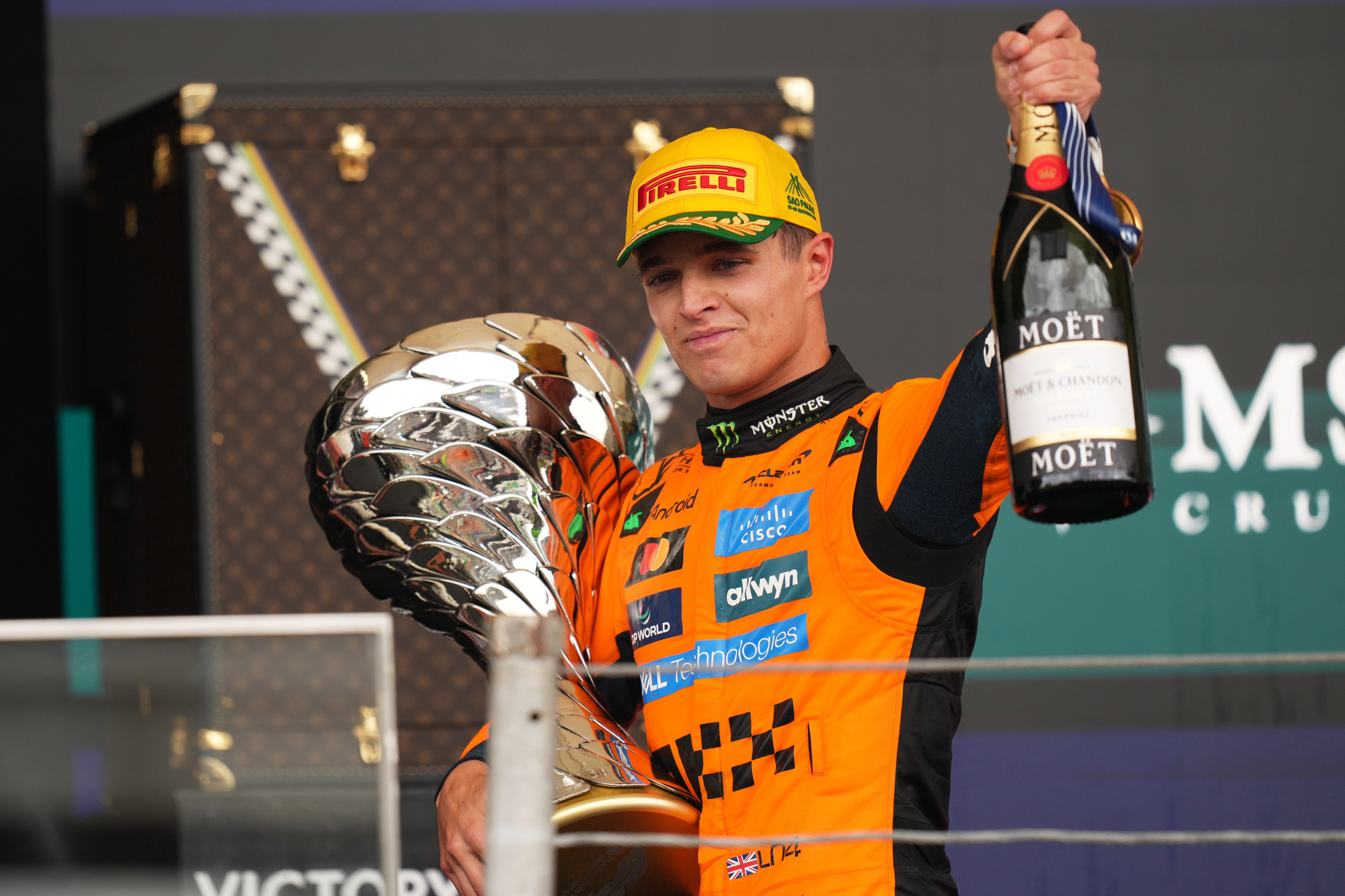 A Racing Bulls employee appeared to encourage the booing of Lando Noris after he won the Brazil GP (Andre Penner/AP)