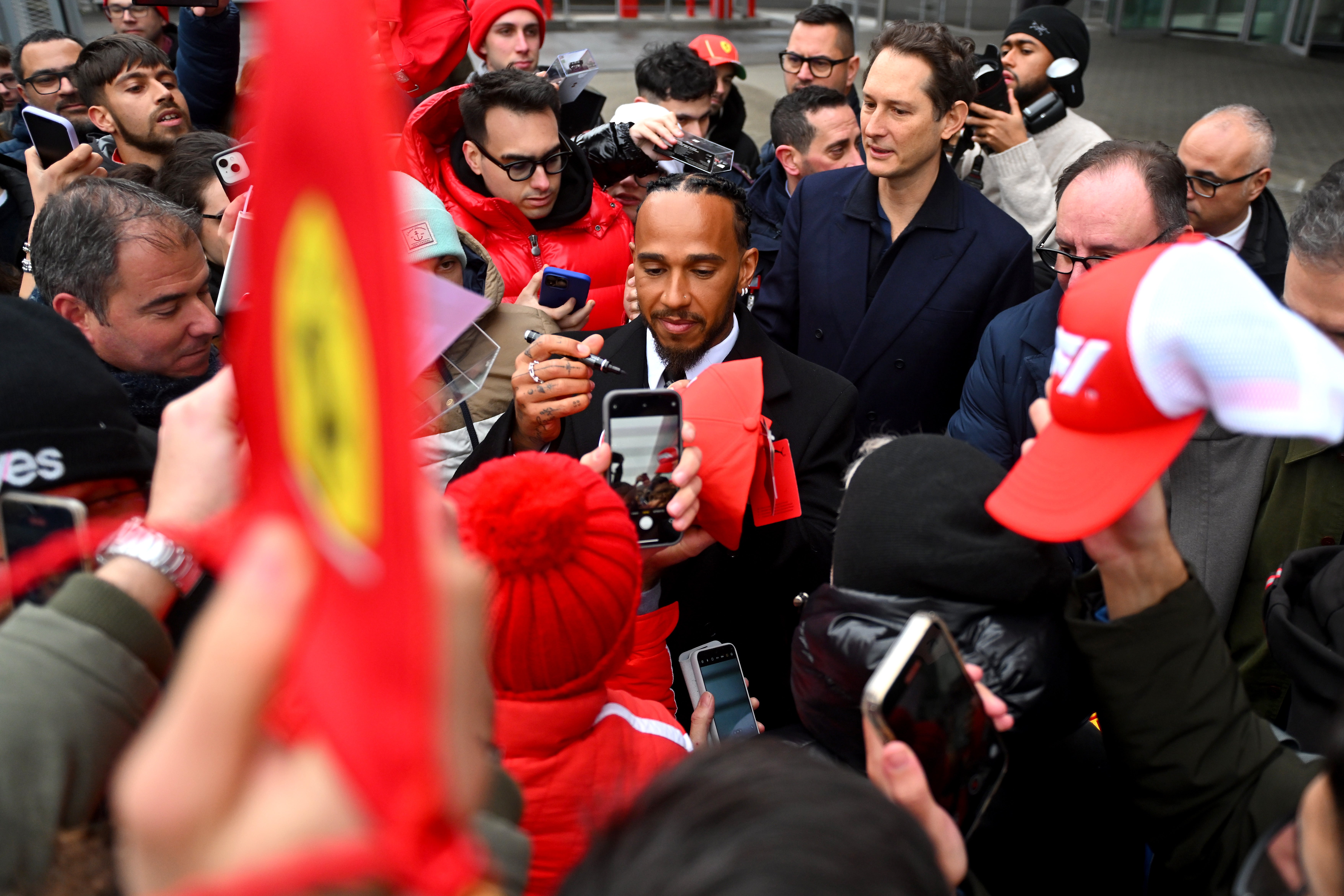 Elkann (top-right) was a key player in persuading Lewis Hamilton to join Ferrari