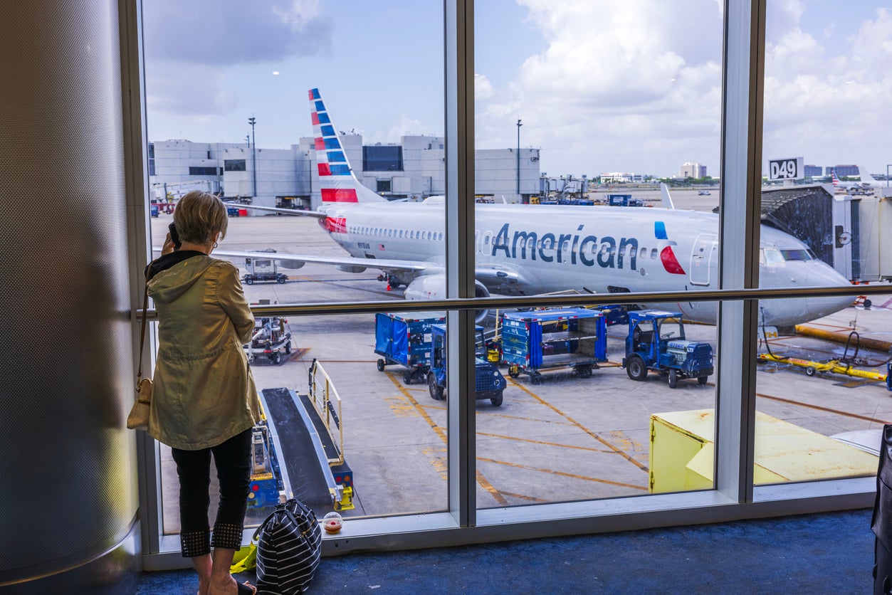 Fares on major US routes have fallen by up to seven percent. Pictured is an American Airlines' plane at Miami International
