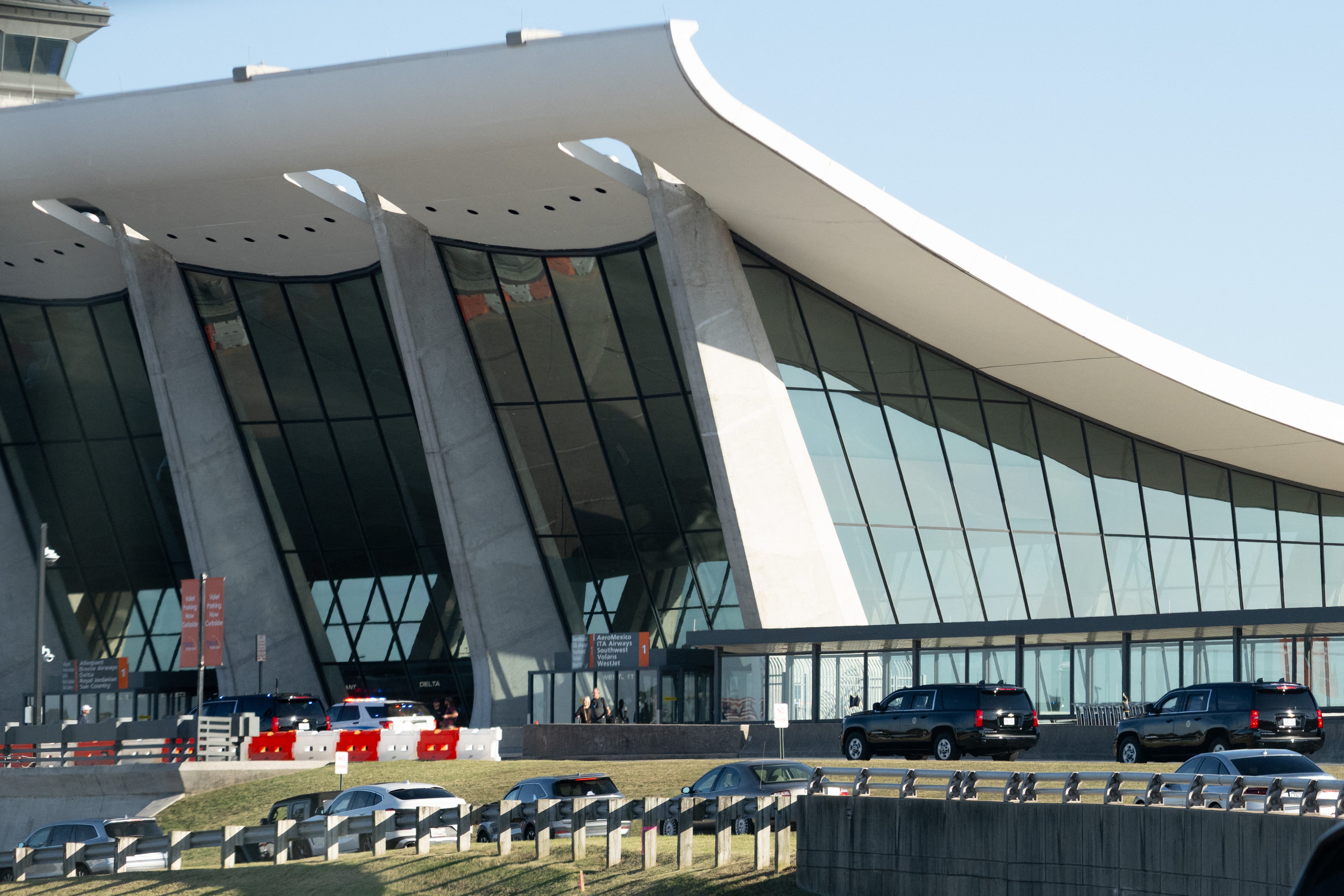 At least 18 passengers have been taken to the hospital after a people mover hit a building dock at Dulles International Airport