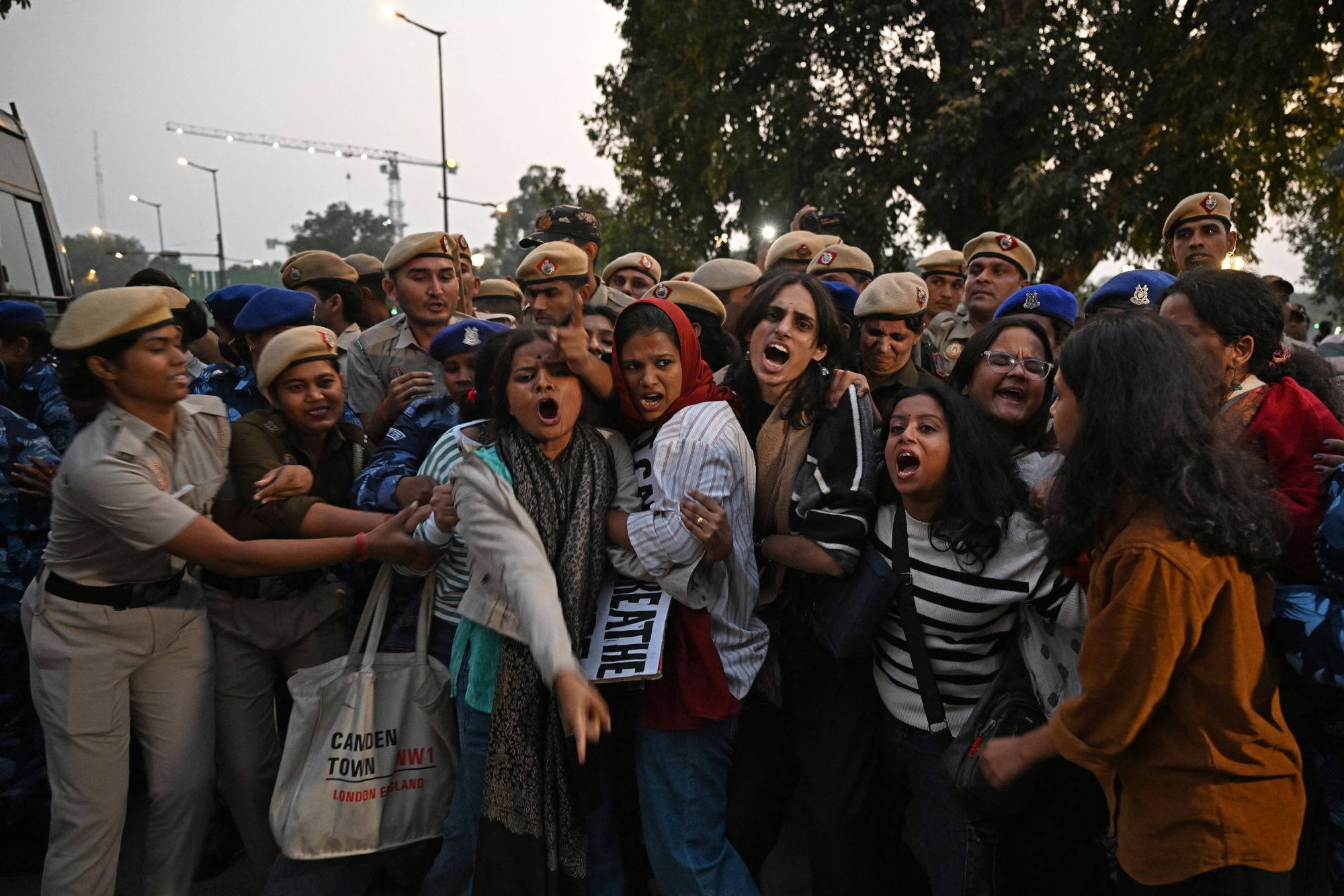 Police detain demonstrators during a protest against air pollution in New Delhi on 9 November 2025