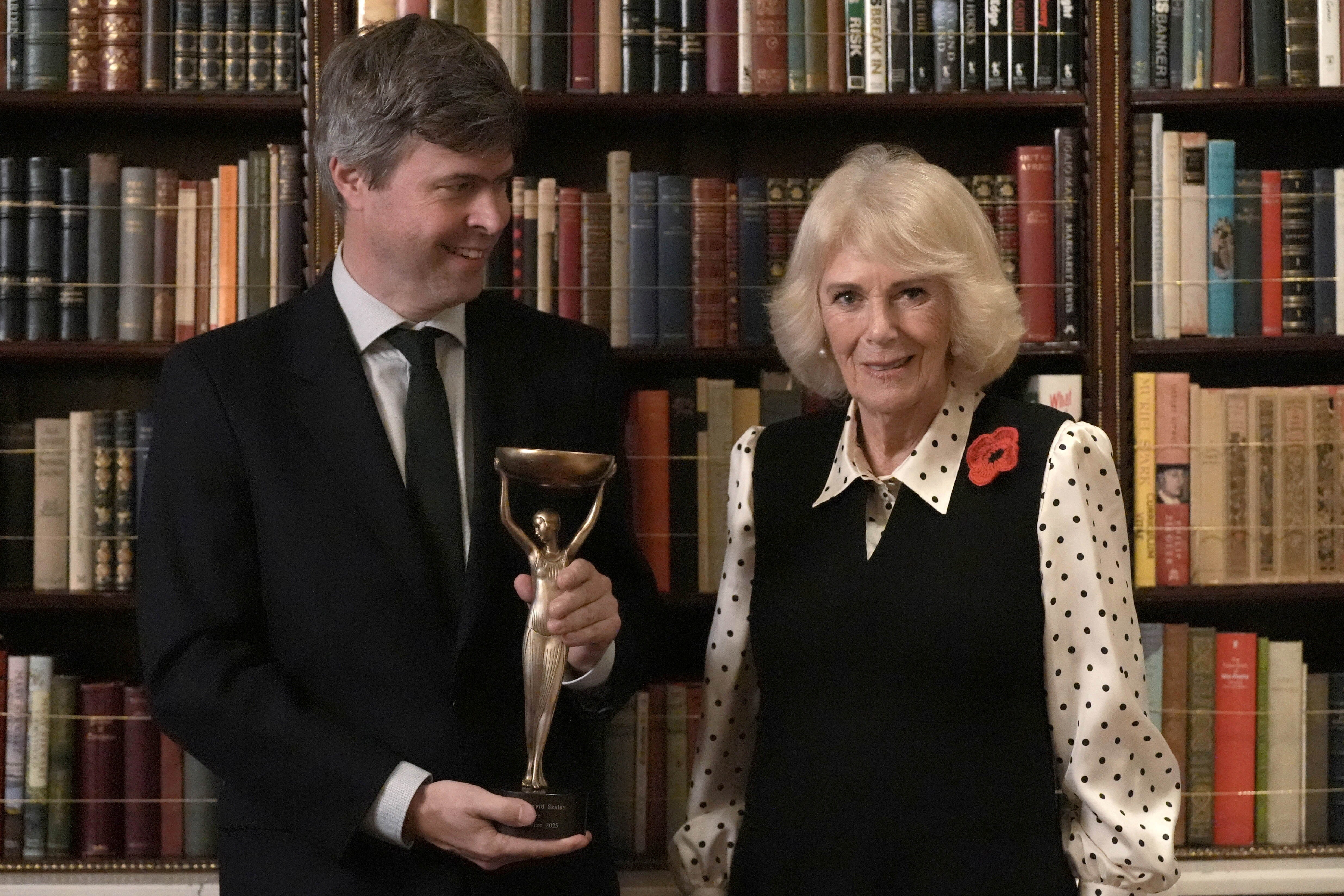 <p>Queen Camilla with 2025 Booker prize winner David Szalay during a reception for shortlisted authors, judges and supporters</p>