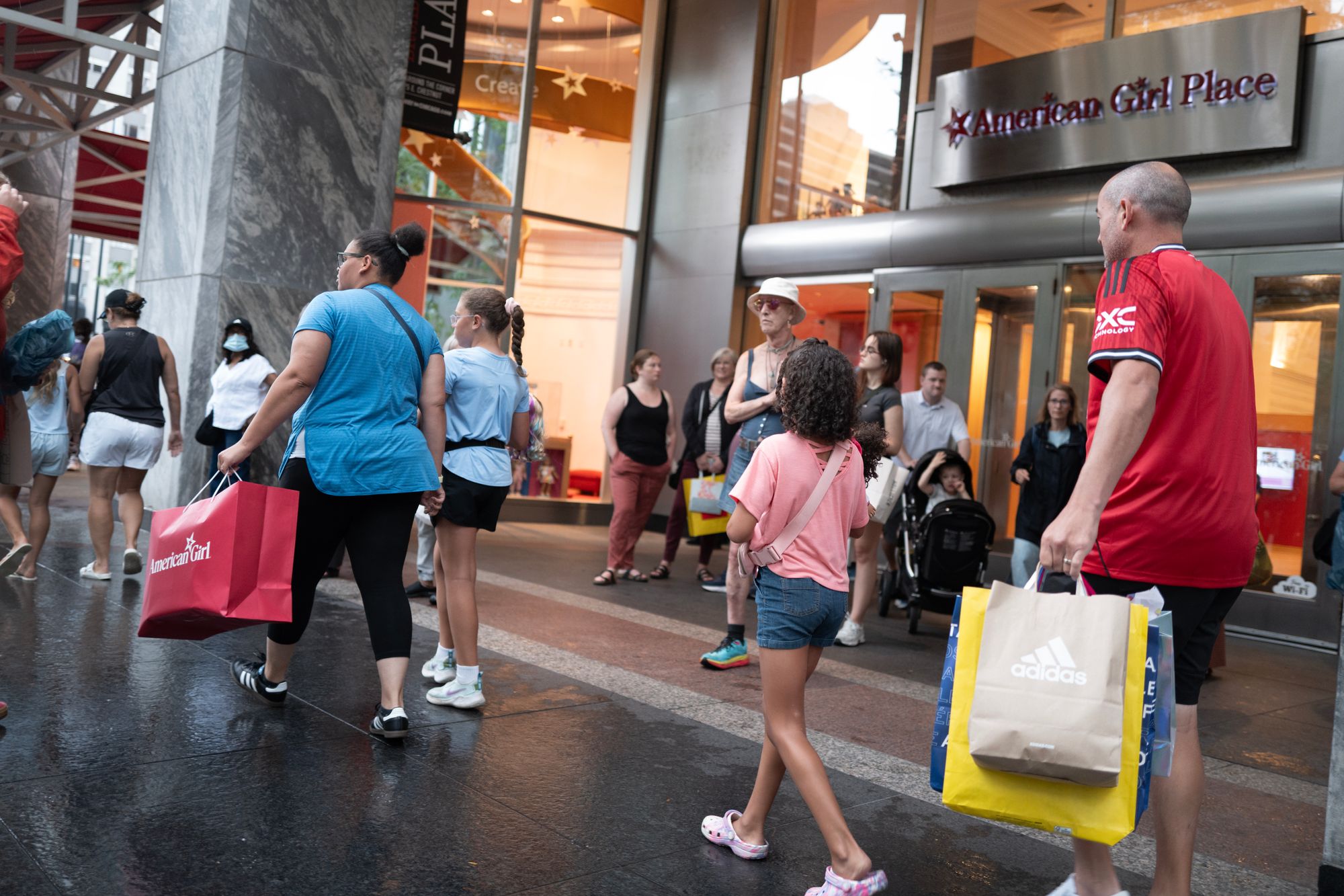 Shoppers at Chicago's Magnificent Mile retail strip - which it appears Trump incorrectly called the ‘Miracle Mile Shopping Center’