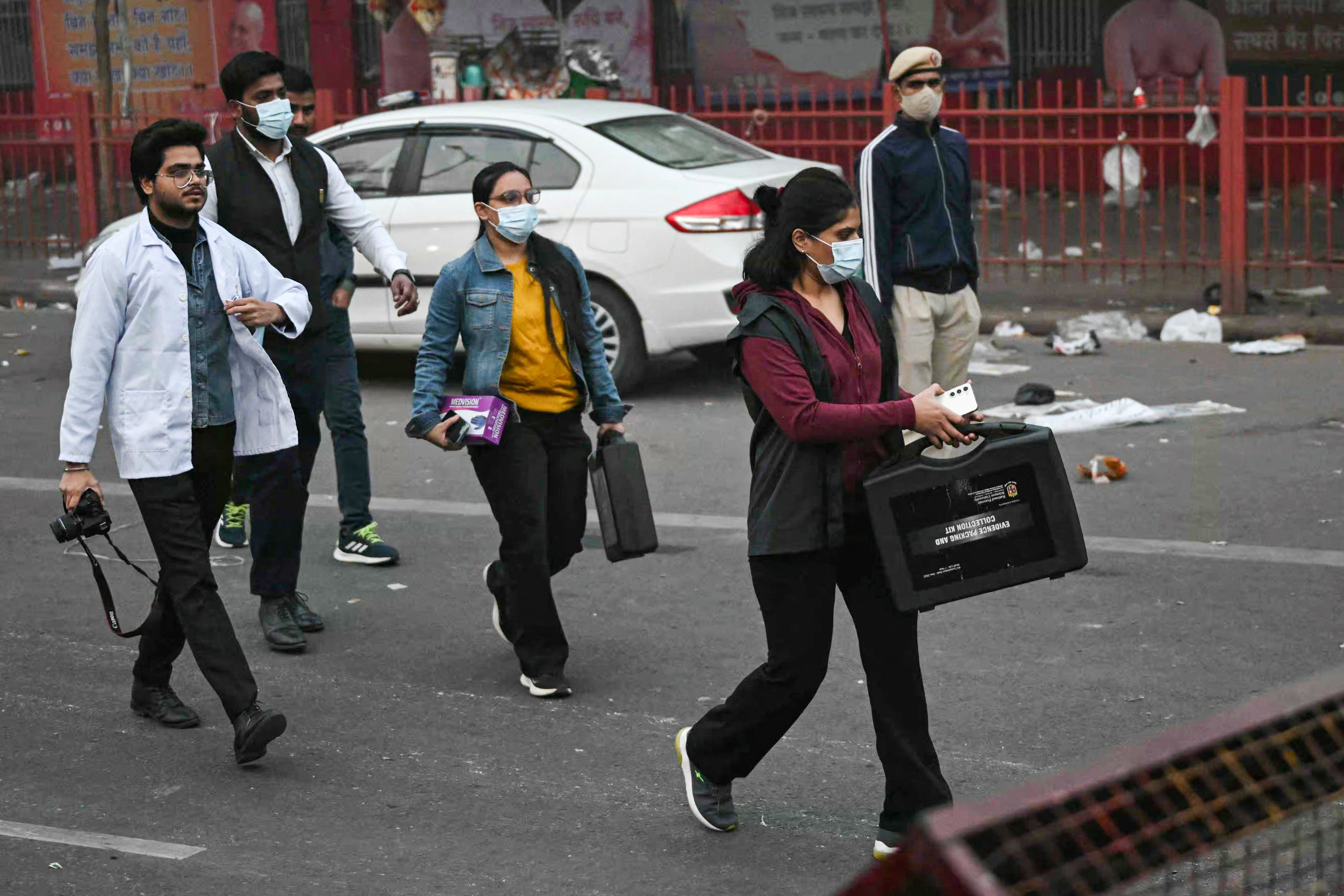 <p>Forensic experts arrive to inspect the blast site following an explosion near the Red Fort in the old quarters of Delhi on 11 November 2025</p>
