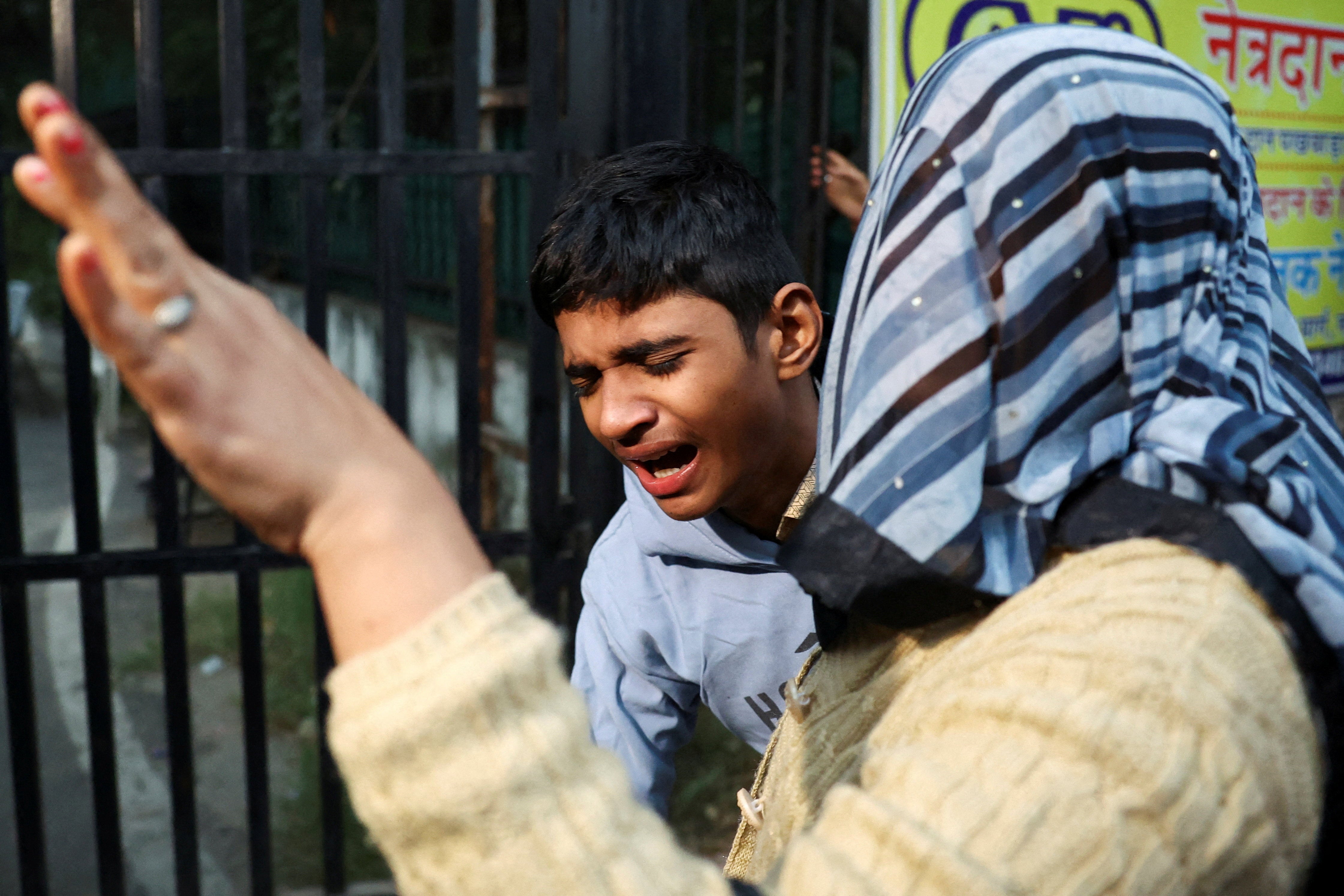 <p>Son of Dinesh Misra, a victim of the explosion in Delhi, outside a mortuary on 11 November 2025</p>