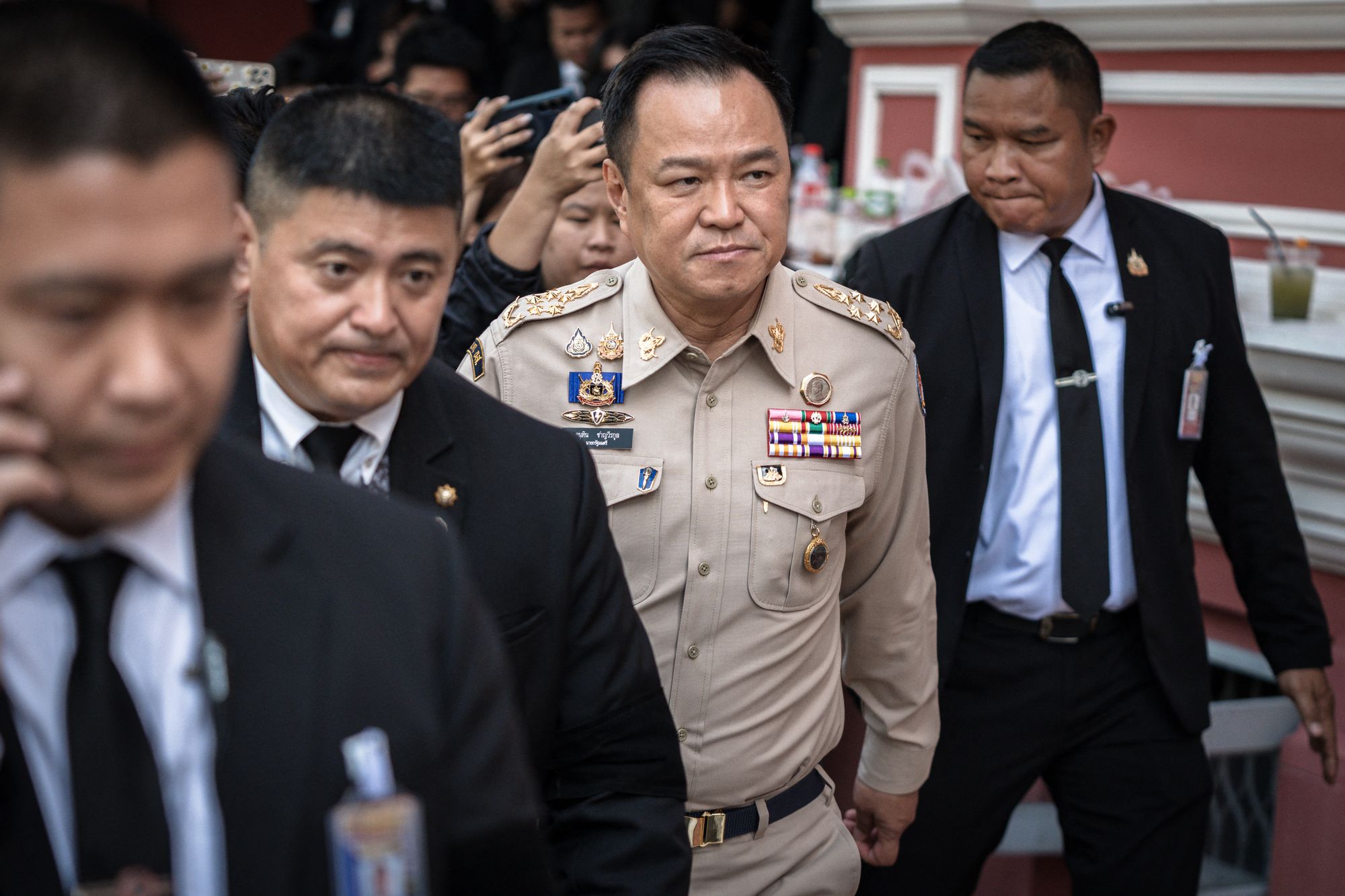 <p>Thailand’s prime minister Anutin Charnvirakul (C) walks after chairing a National Security Council (NSC) meeting at the Government House in Bangkok on 11 November 2025</p>