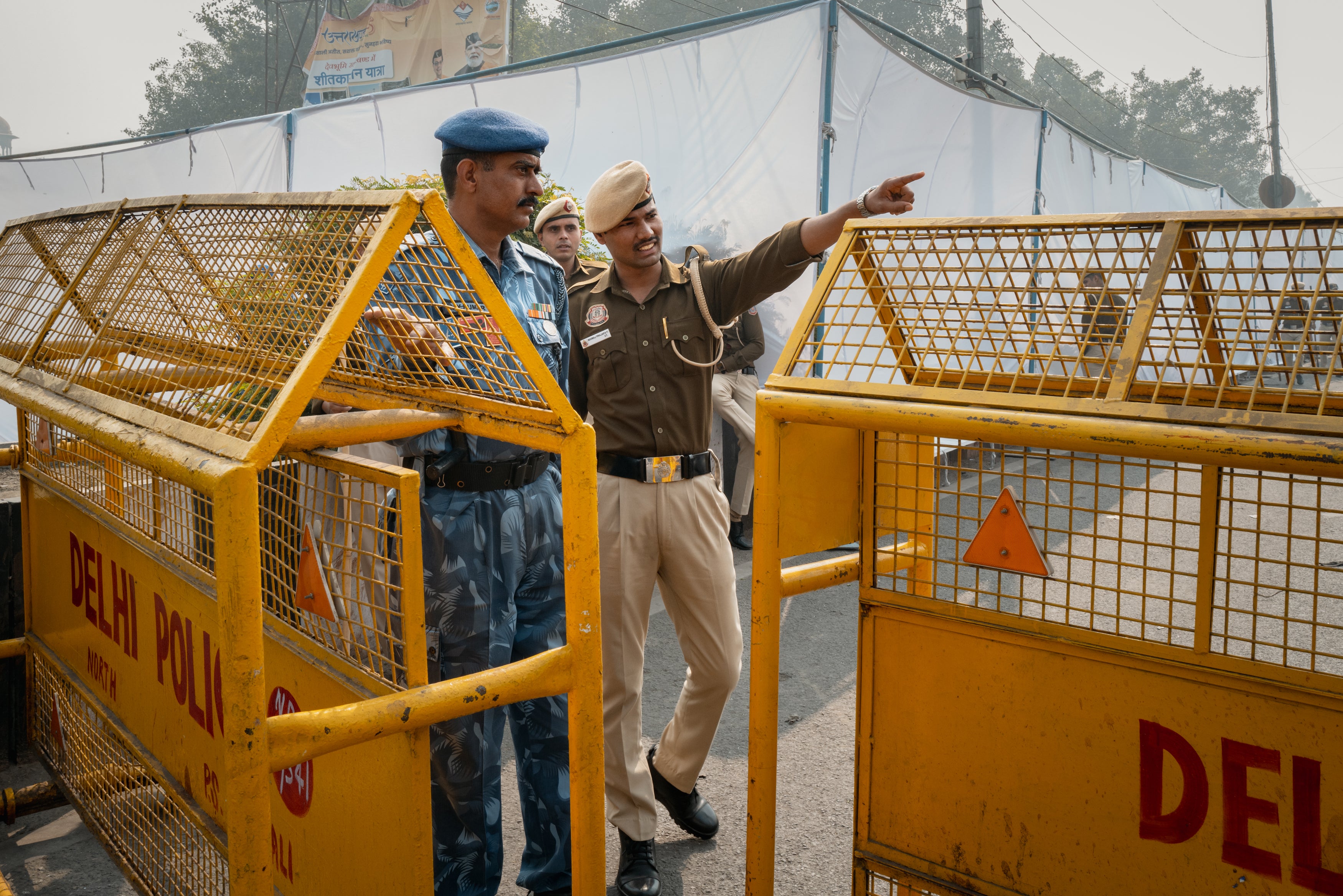Security personnel seals off and guards blast site following an explosion at a Metro station