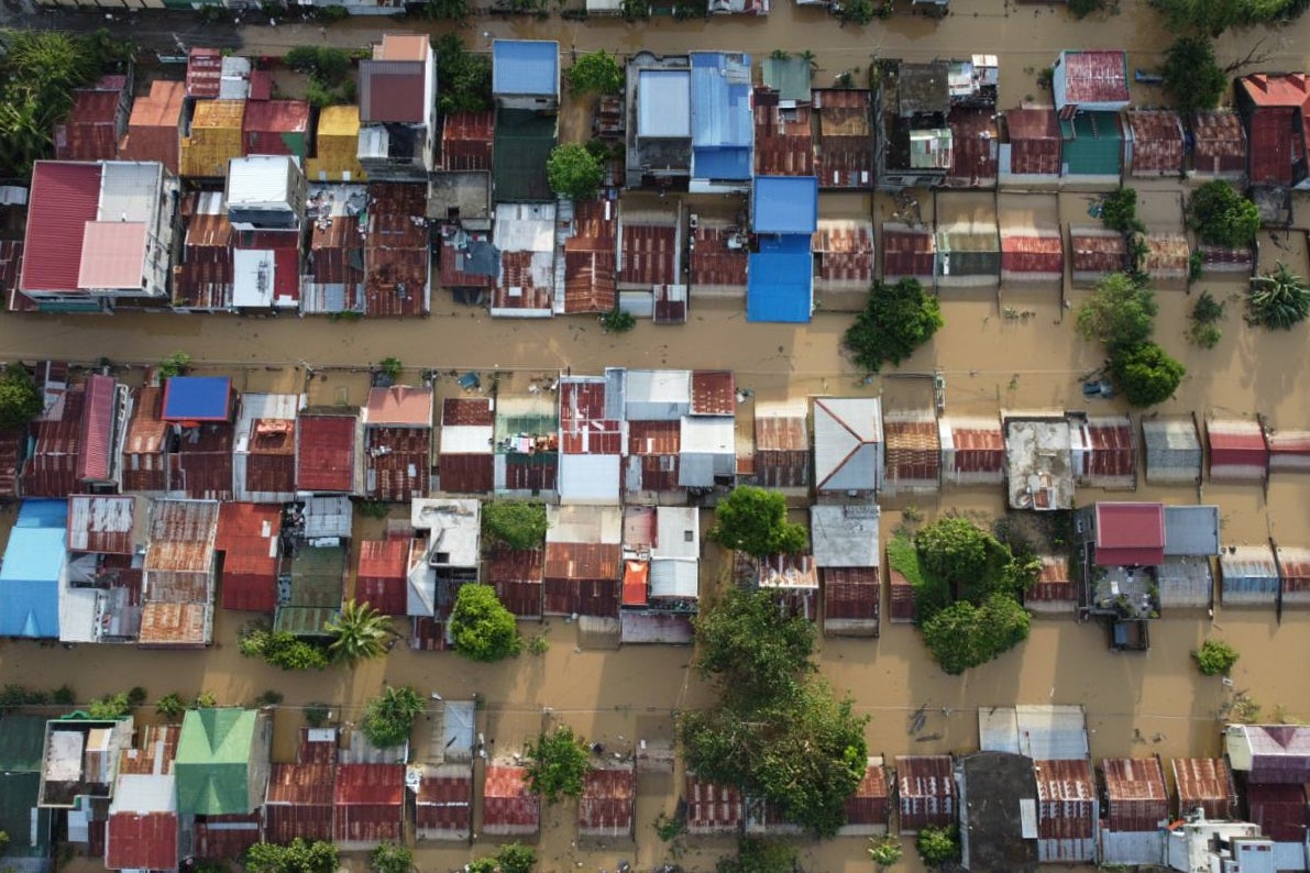 <p>Houses lie submerged in floodwaters after Typhoon Fung-wong hit  Ilagan, Isabela province, northern Philippines</p>