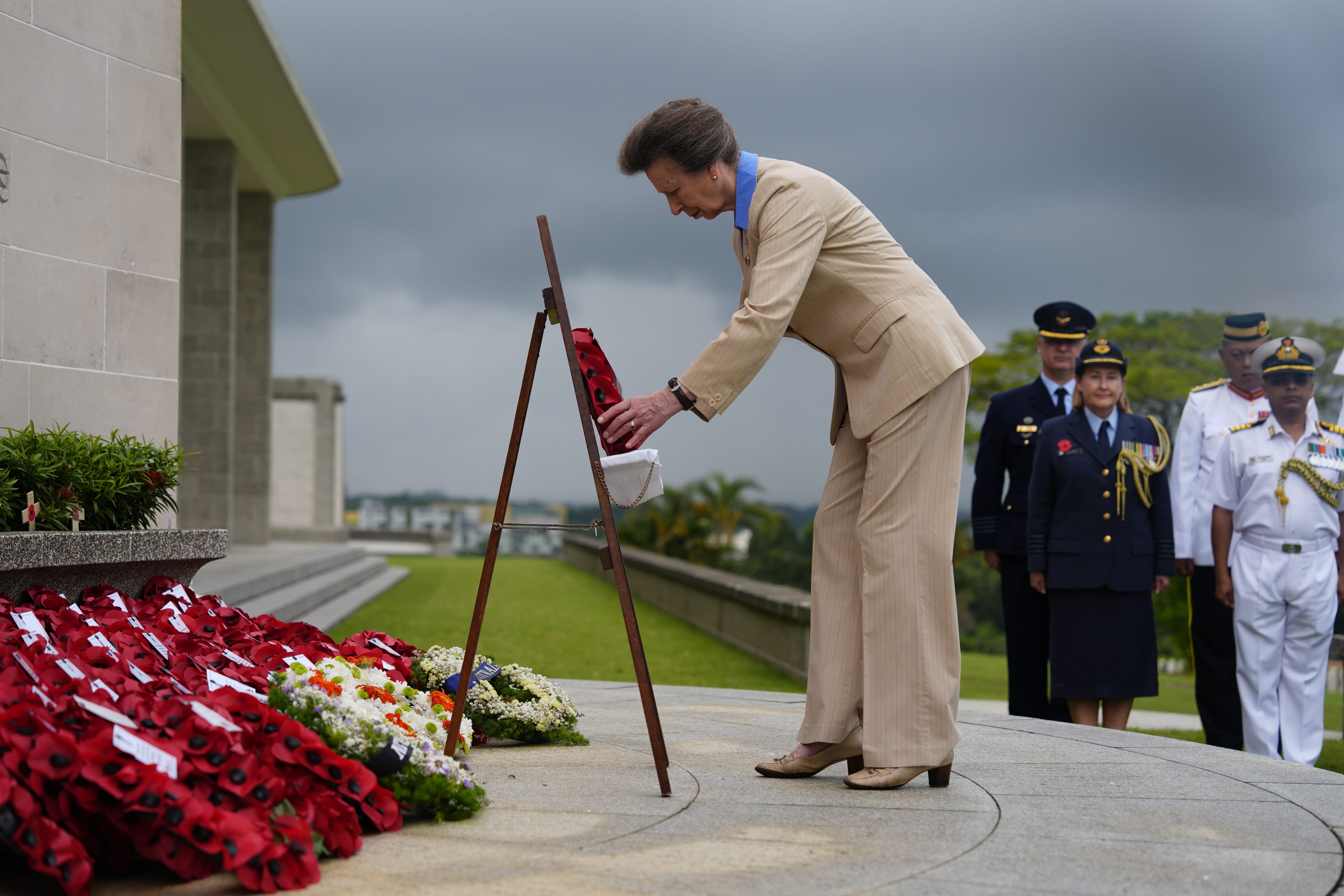 The Princess Royal, President of the Commonwealth War Graves Commission (CWGC), and Vice Admiral Sir Tim Laurence, lays a wreath during Service of Remembrance at the Kranji War Cemetery in Singapore (Jordan Pettitt/PA)