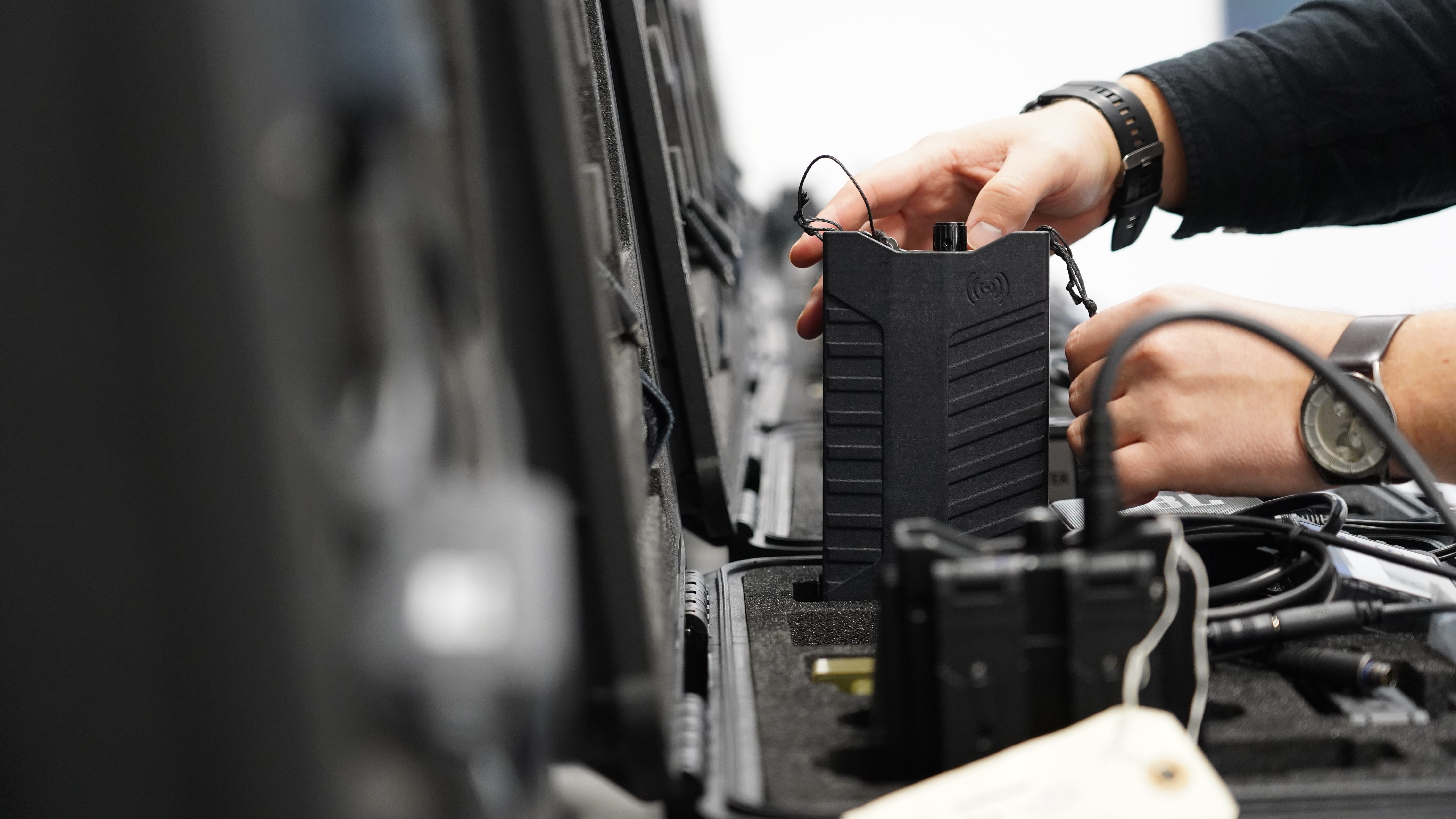 A worker packs away assembled counter drone devices at MyDefence's headquarters in Alborg, Denmark