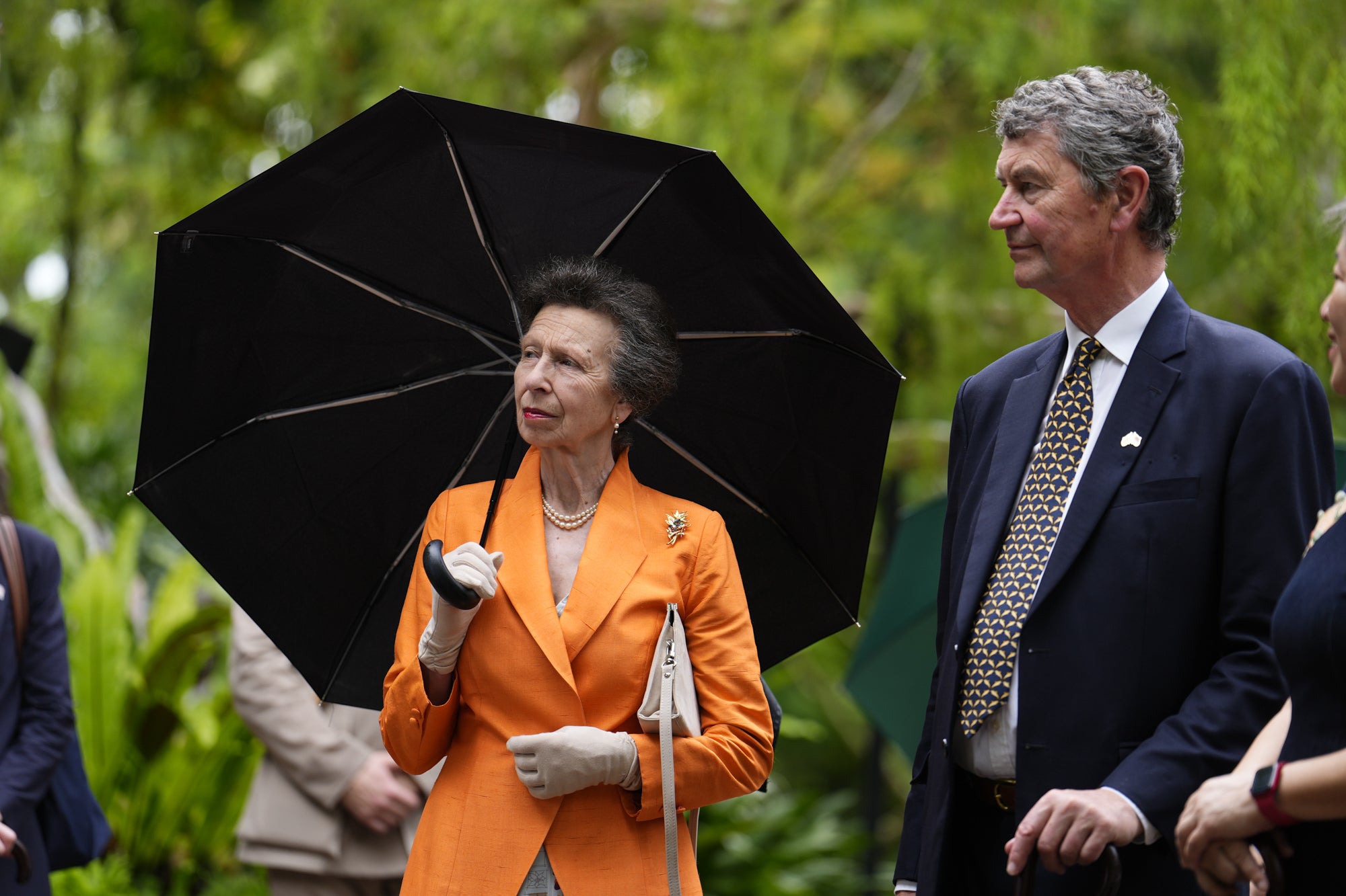 Anne was guided through the VIP garden, a dedicated display featuring orchid hybrids named in honour of heads of state and international dignitaries, with an umbrella providing shelter from the elements