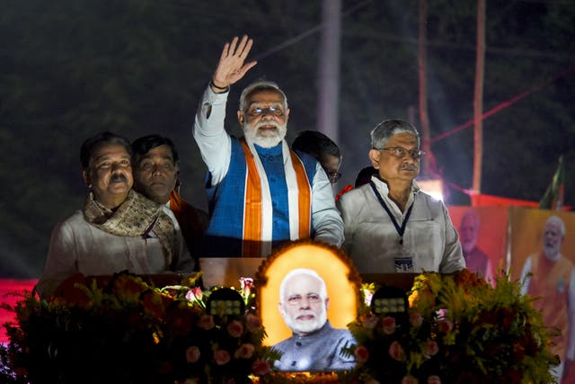 <p>Narendra Modi waves during a rally in Patna ahead of the state election in Bihar</p>