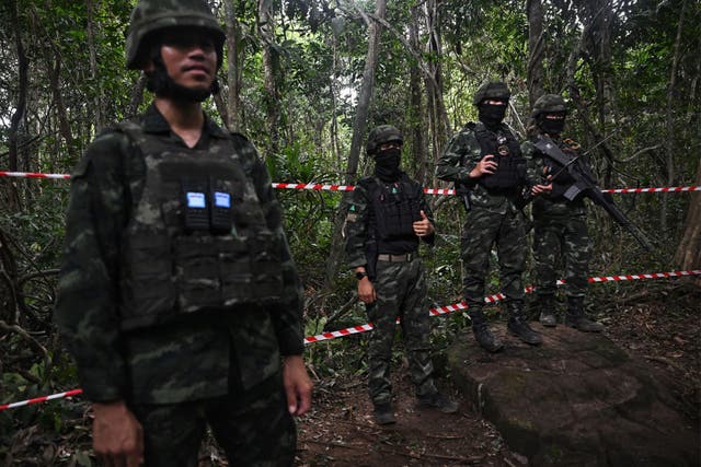 <p>Royal Thai Army soldiers listen to a briefing in an area along the Thai-Cambodian border last year</p>