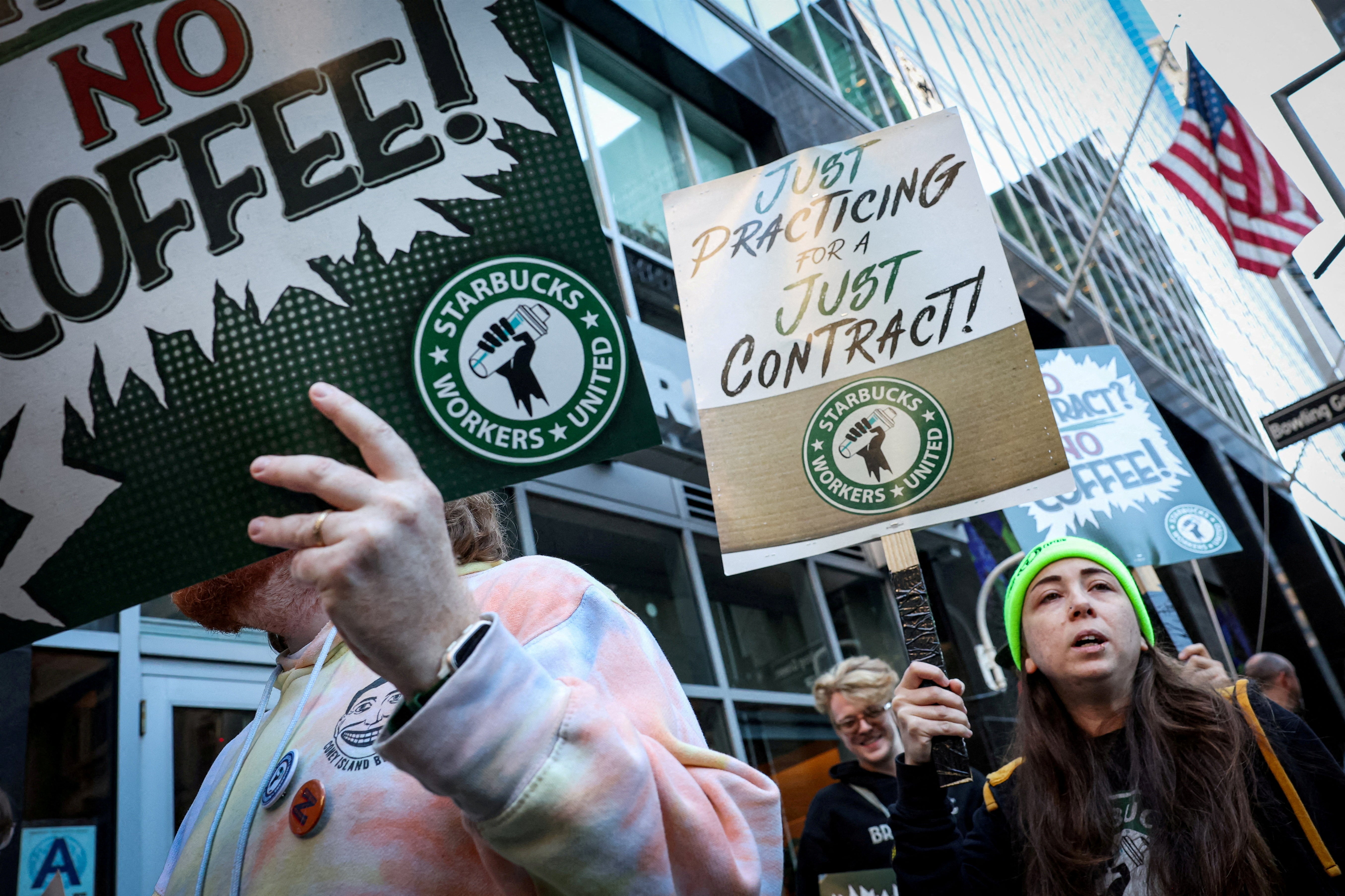 Workers picket in front of a Starbucks outlet in New York City, U.S., October 1, 2025