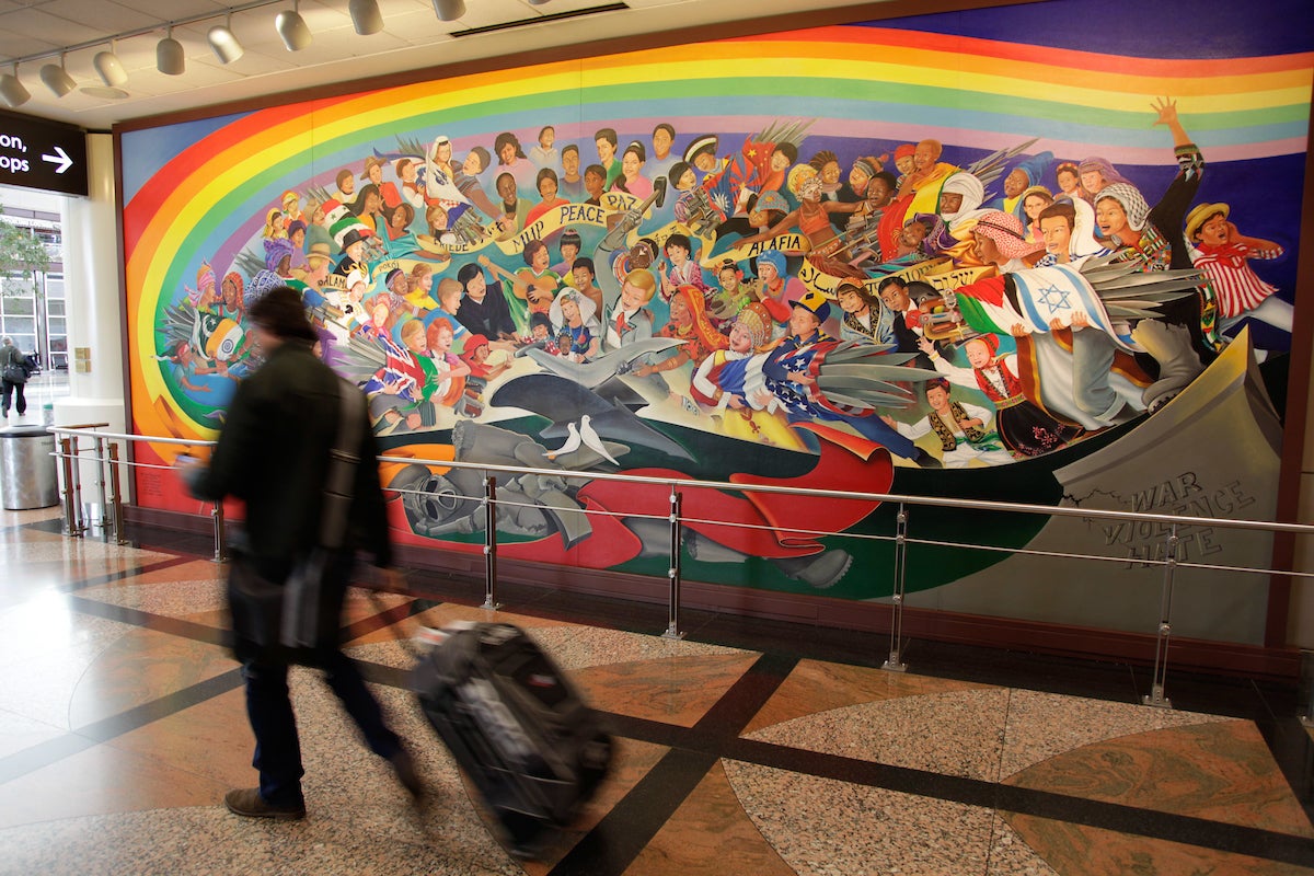 Inside the terminals, artist Leo Tanguma’s sprawling murals depicting war, destruction, and children in coffins have sparked endless debate over the years