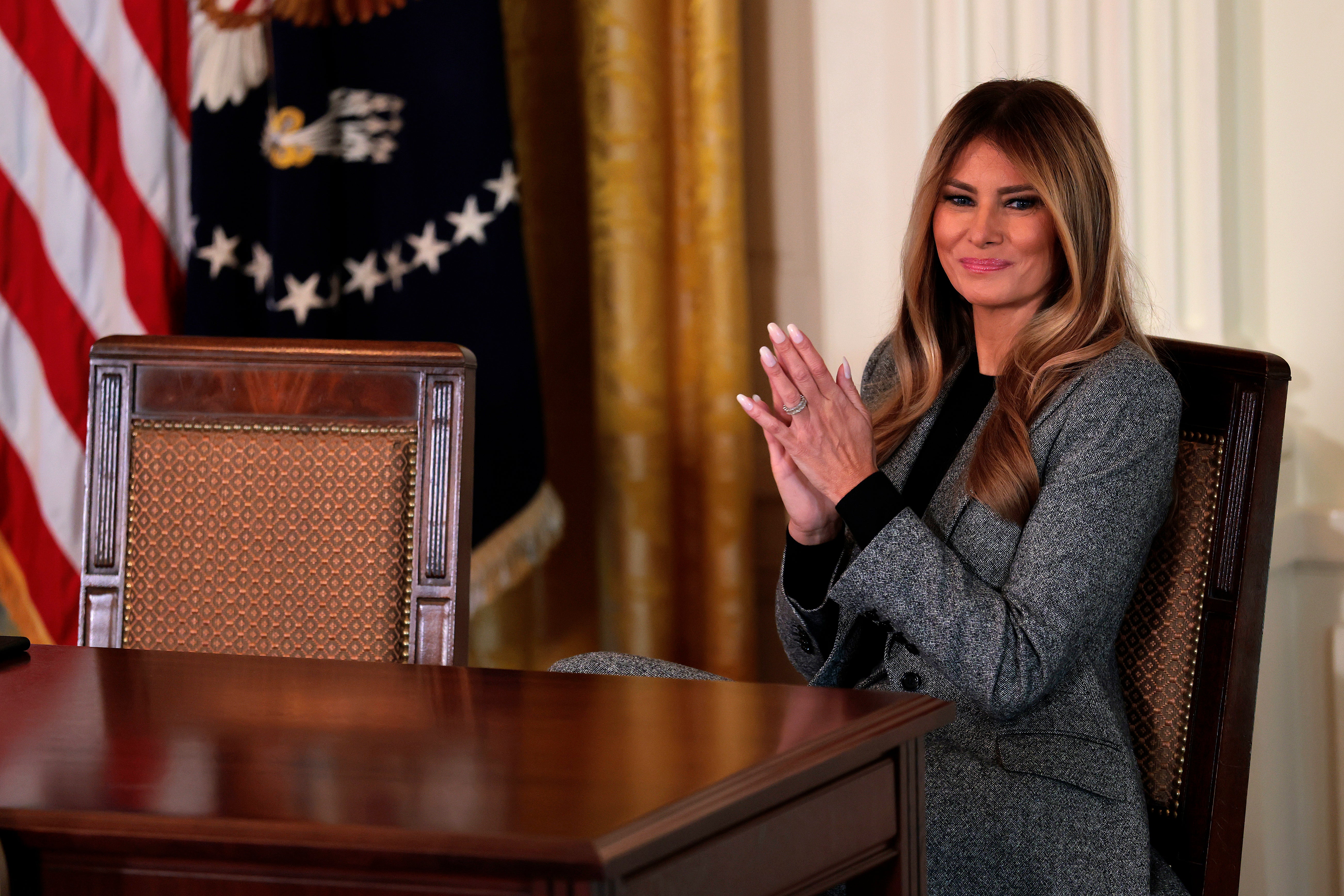 First lady Melania Trump claps during an event for the signing of an executive order on the foster care system on November 13, 2025