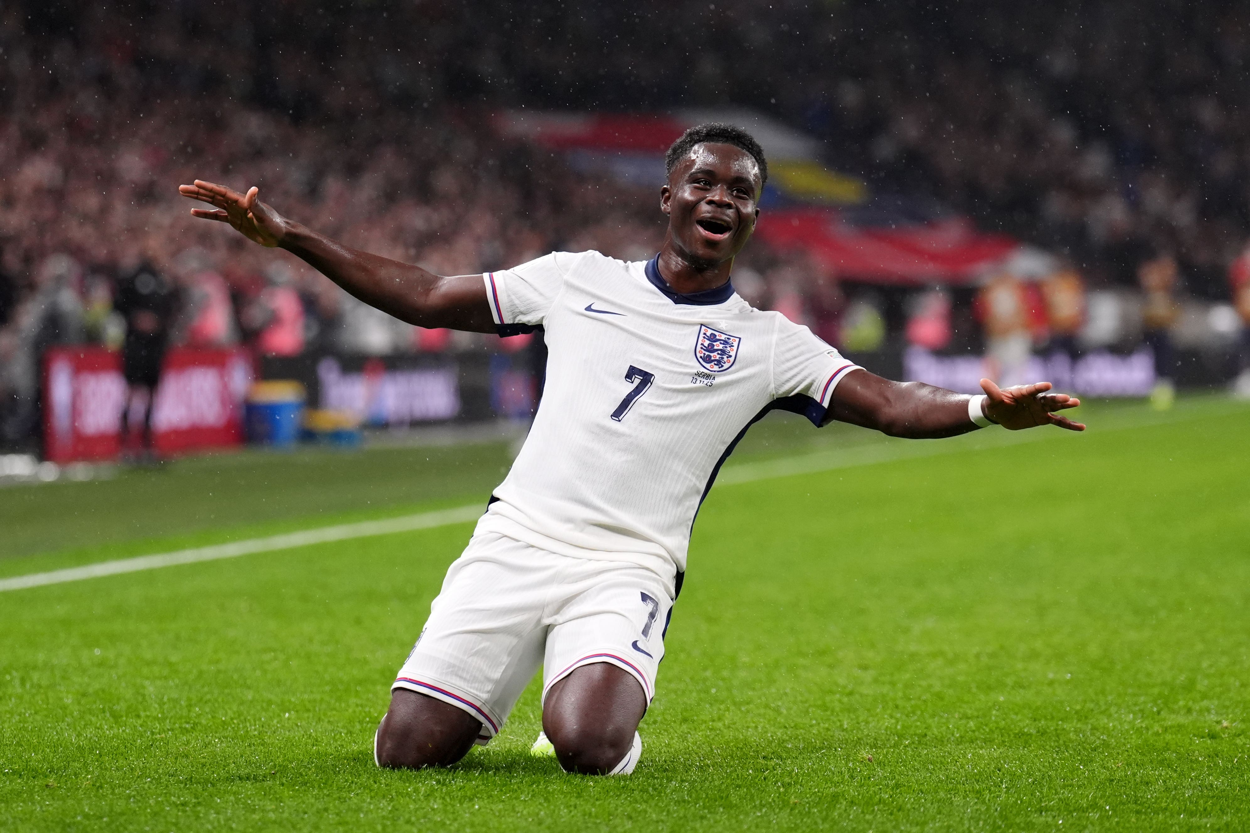 Saka celebrates after his shot hits the net