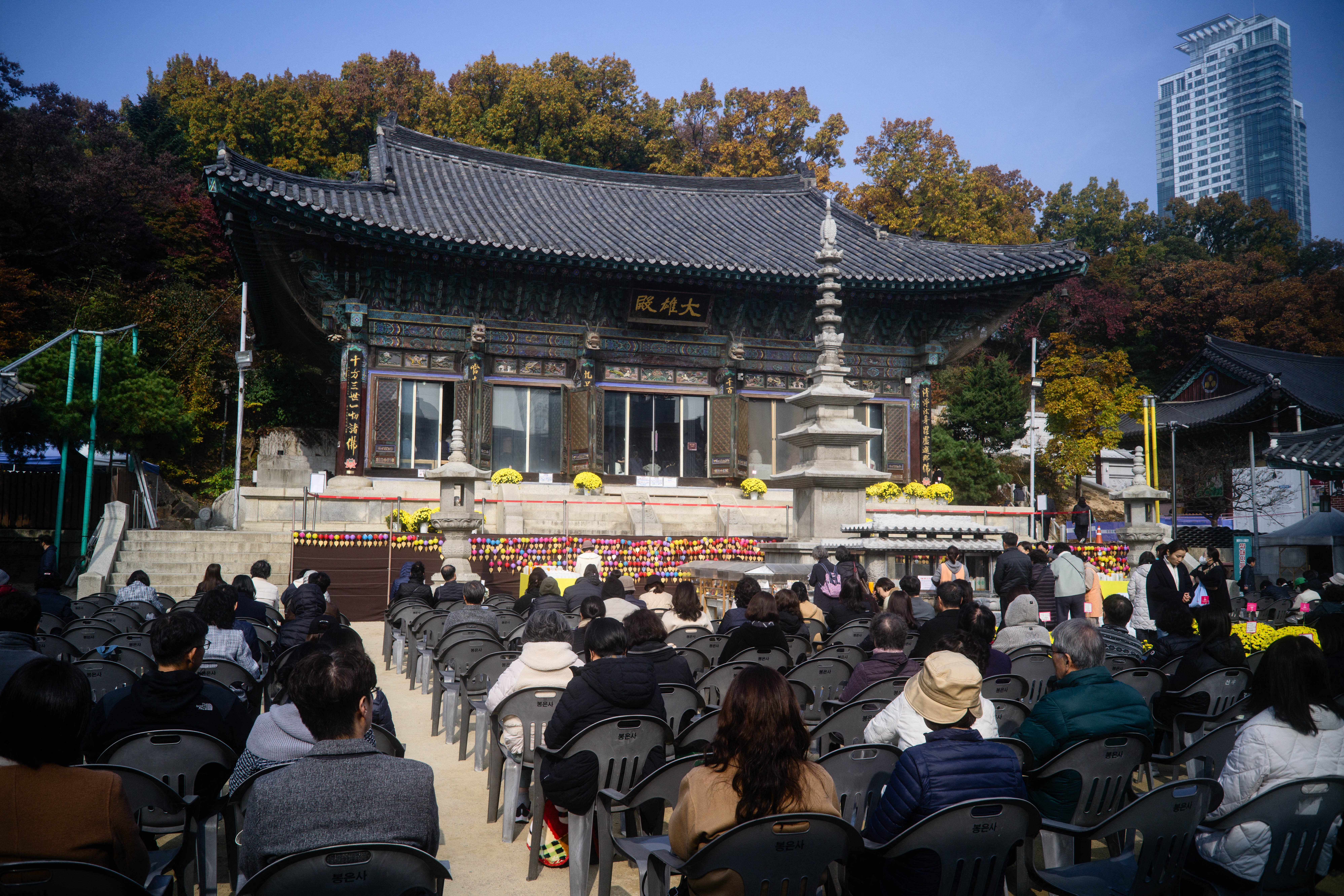 South Korean Buddhists pray at the Bongeunsa Temple as students sit for the annual college entrance exam, known locally as Suneung