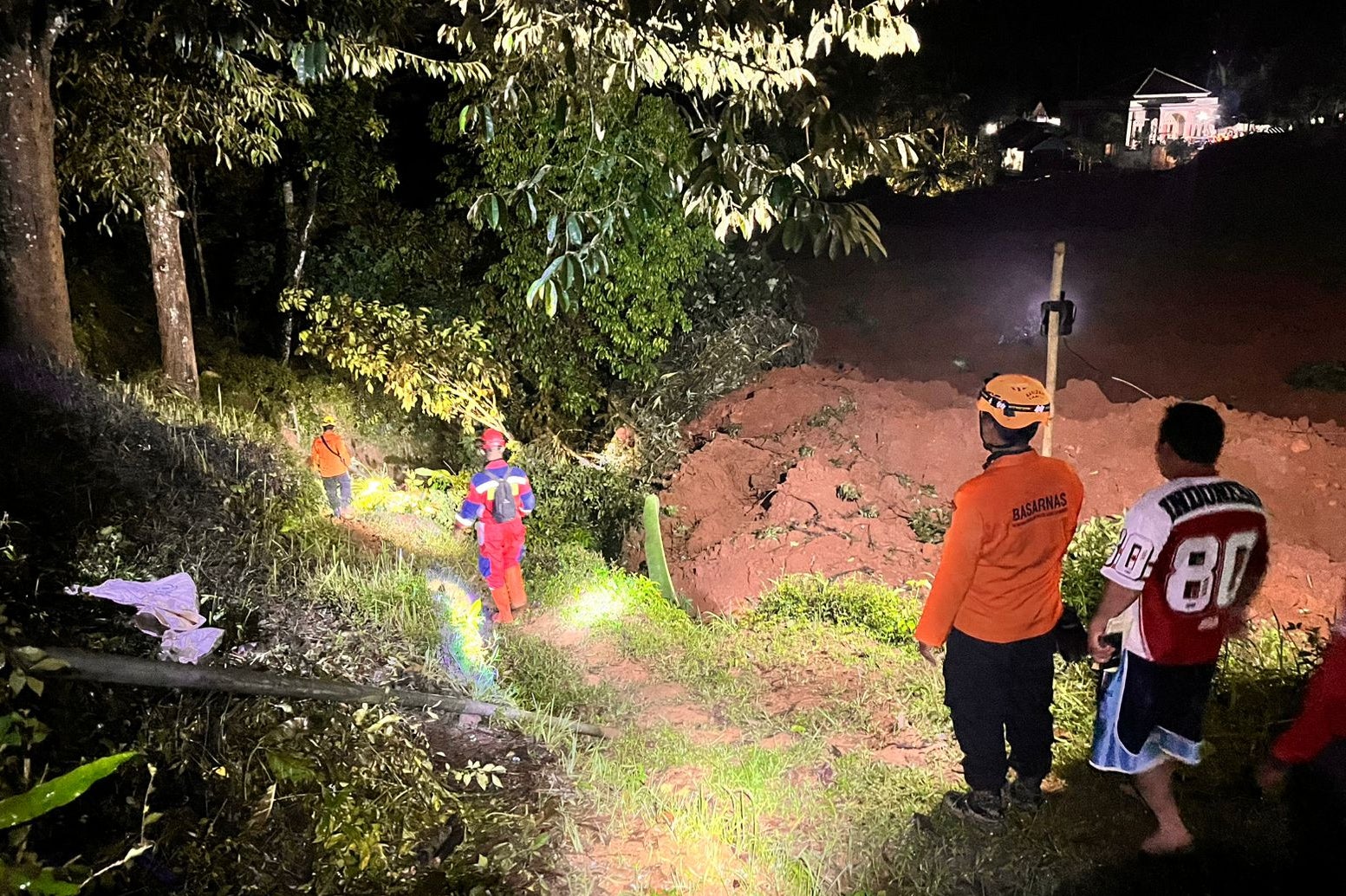 Rescuers search for victims after a landslide