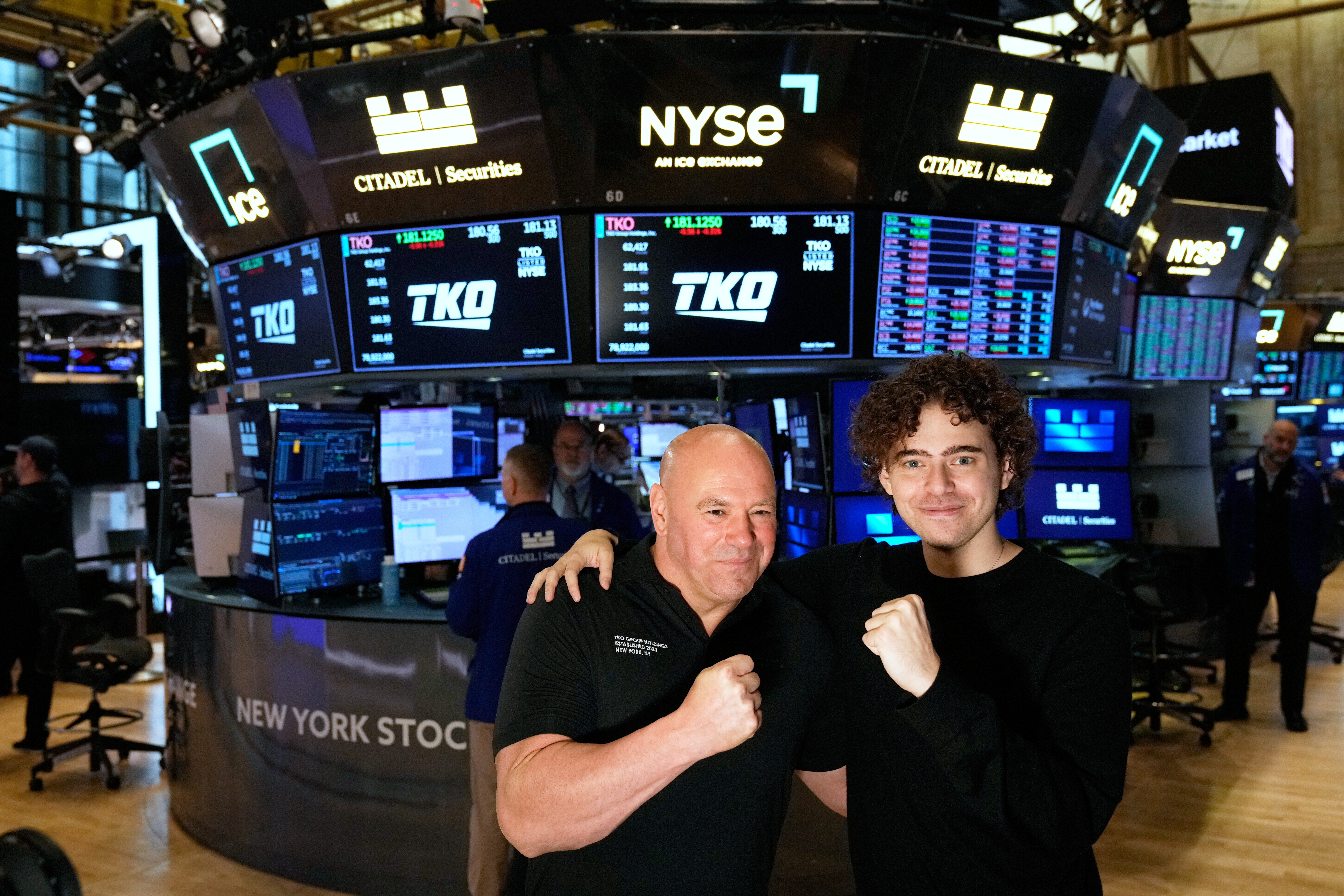 PolyMarket CEO Shayne Coplan, right, and UFC CEO Dana White pose for a picture on the floor of the New York Stock Exchange in New York, Thursday, Nov. 13, 2025. (AP Photo/Seth Wenig)