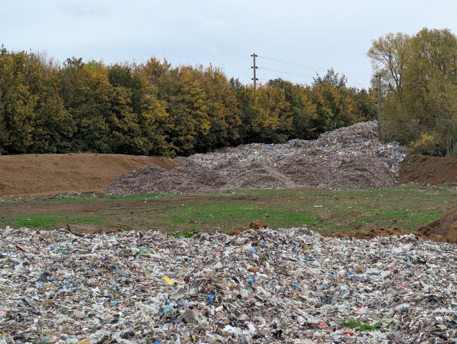Lib Dem MP says the mountain of waste is increasing the risk of fire in the field