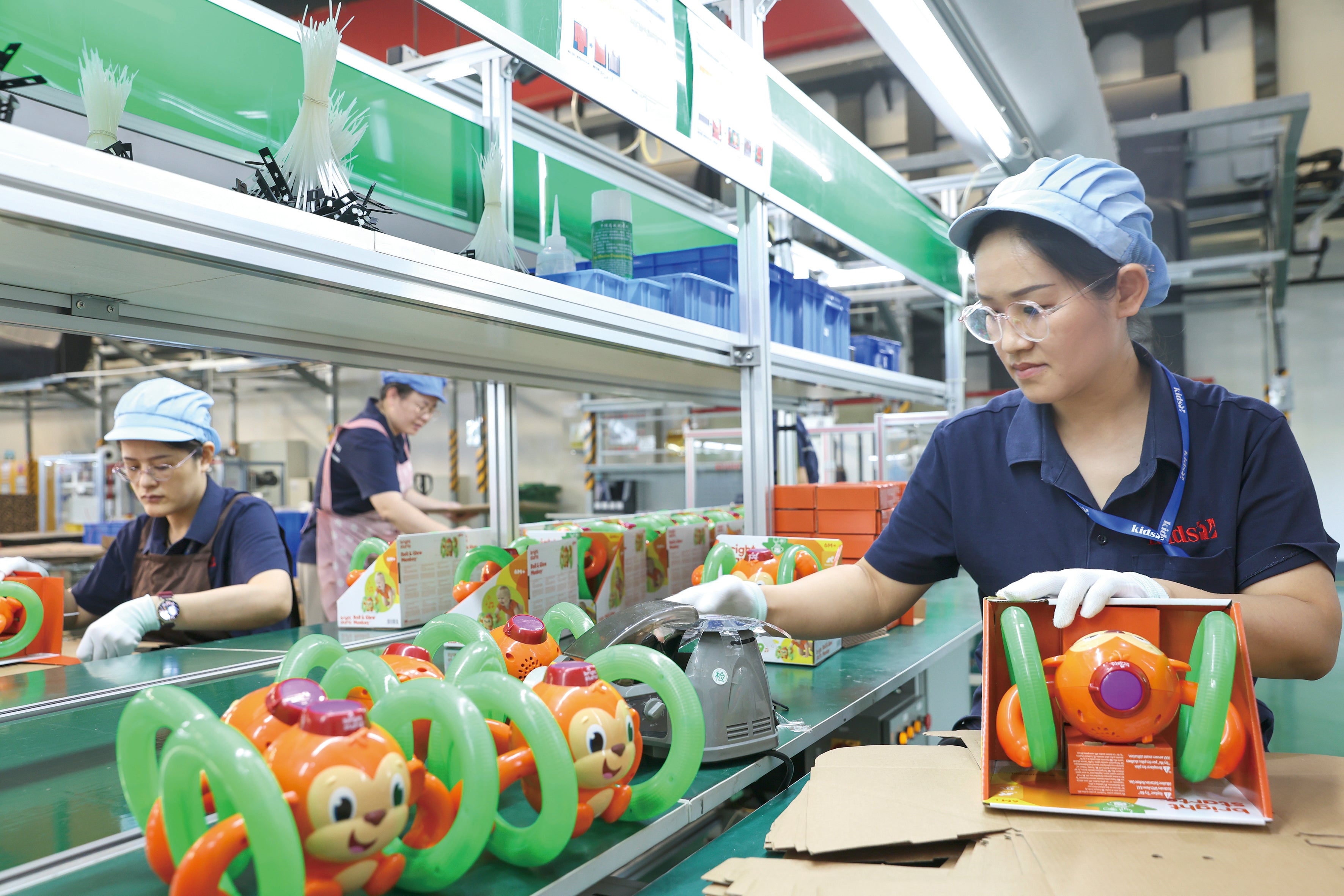 <p>Employees work on the production line of a foreign-funded company in Jiujiang, Jiangxi province</p>