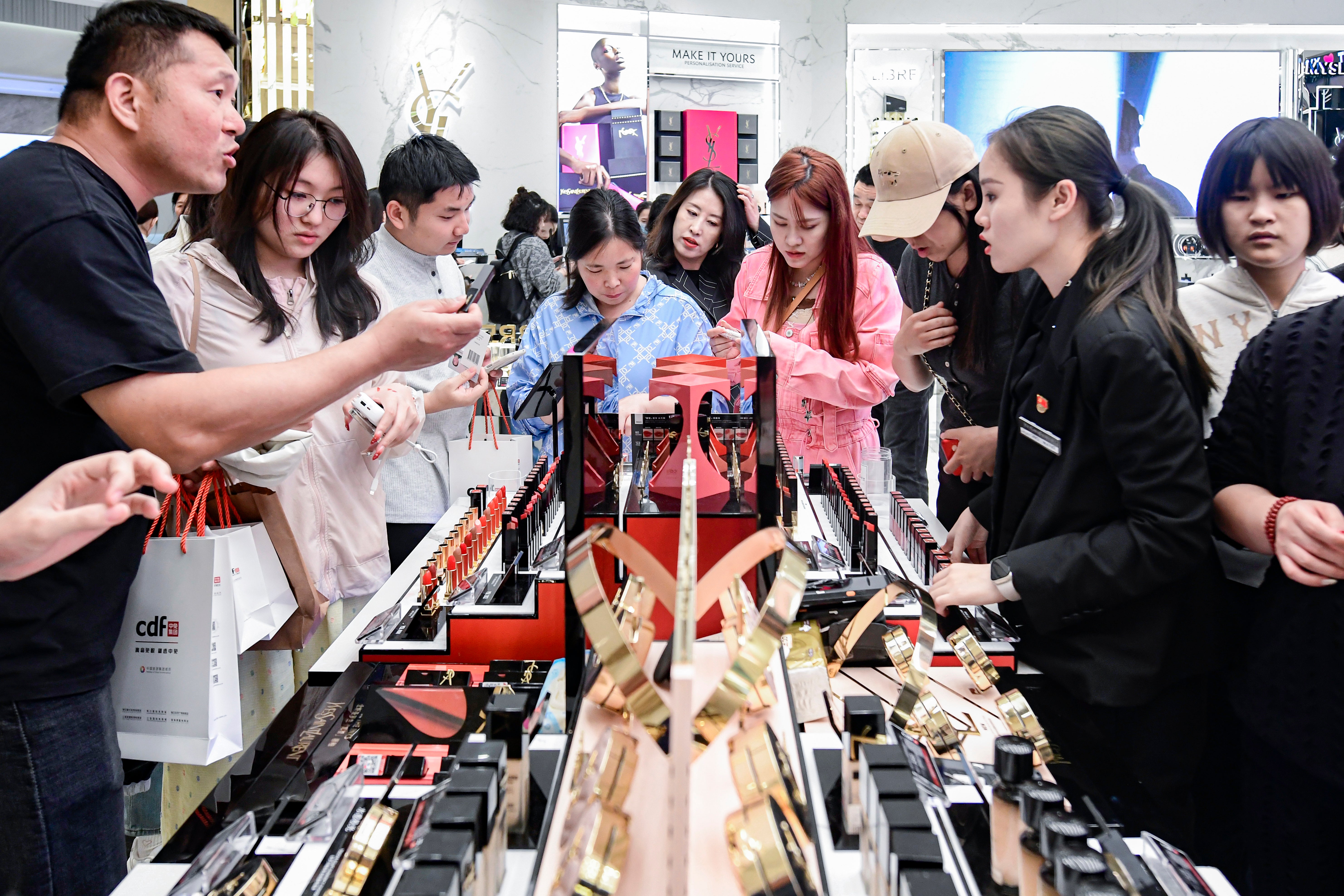 Customers select goods at Haikou International Duty-Free City in Haikou in February