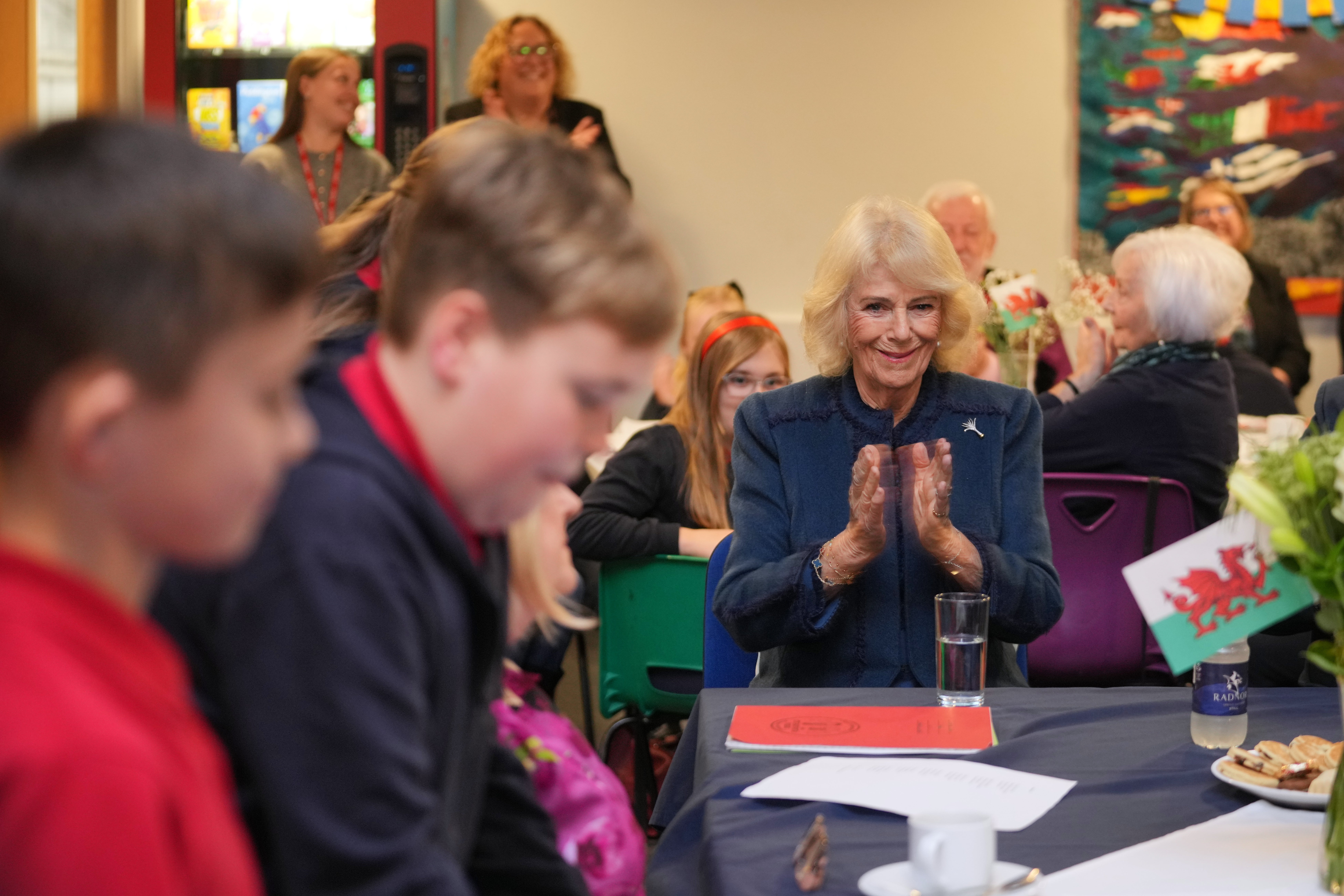 The Queen meets pupils during a visit to Cyfarthfa Primary School in Merthyr Tydfil (Kin Cheung/PA)