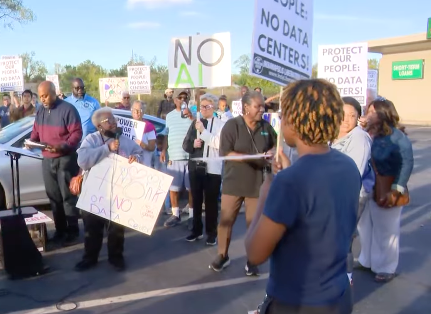 Protesters in Indianapolis gather to demonstrate against a data center planned for the Martindale-Brightwood neighborhood in October. While data farms promise jobs and local investment, they can also require millions of gallons fresh water to operate, gobble up fossil fuel power and create a huge amount of noise