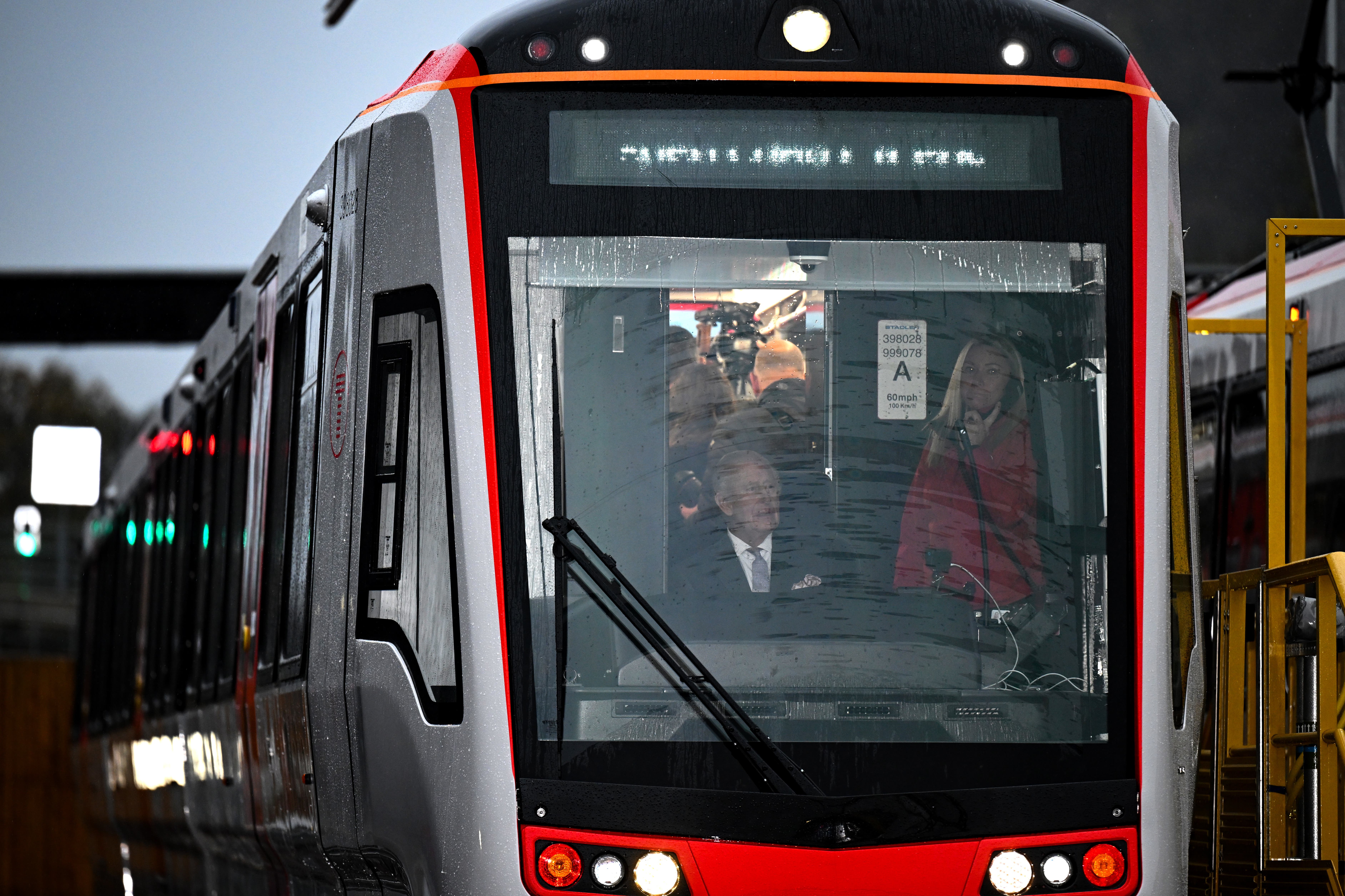The King at the controls of a tram-train within the depot at the official opening of the South Wales Metro Depot in Taff’s Well