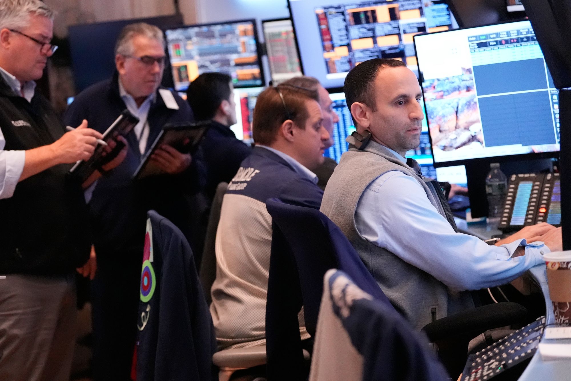 Traders work on the floor at the New York Stock Exchange on Thursday