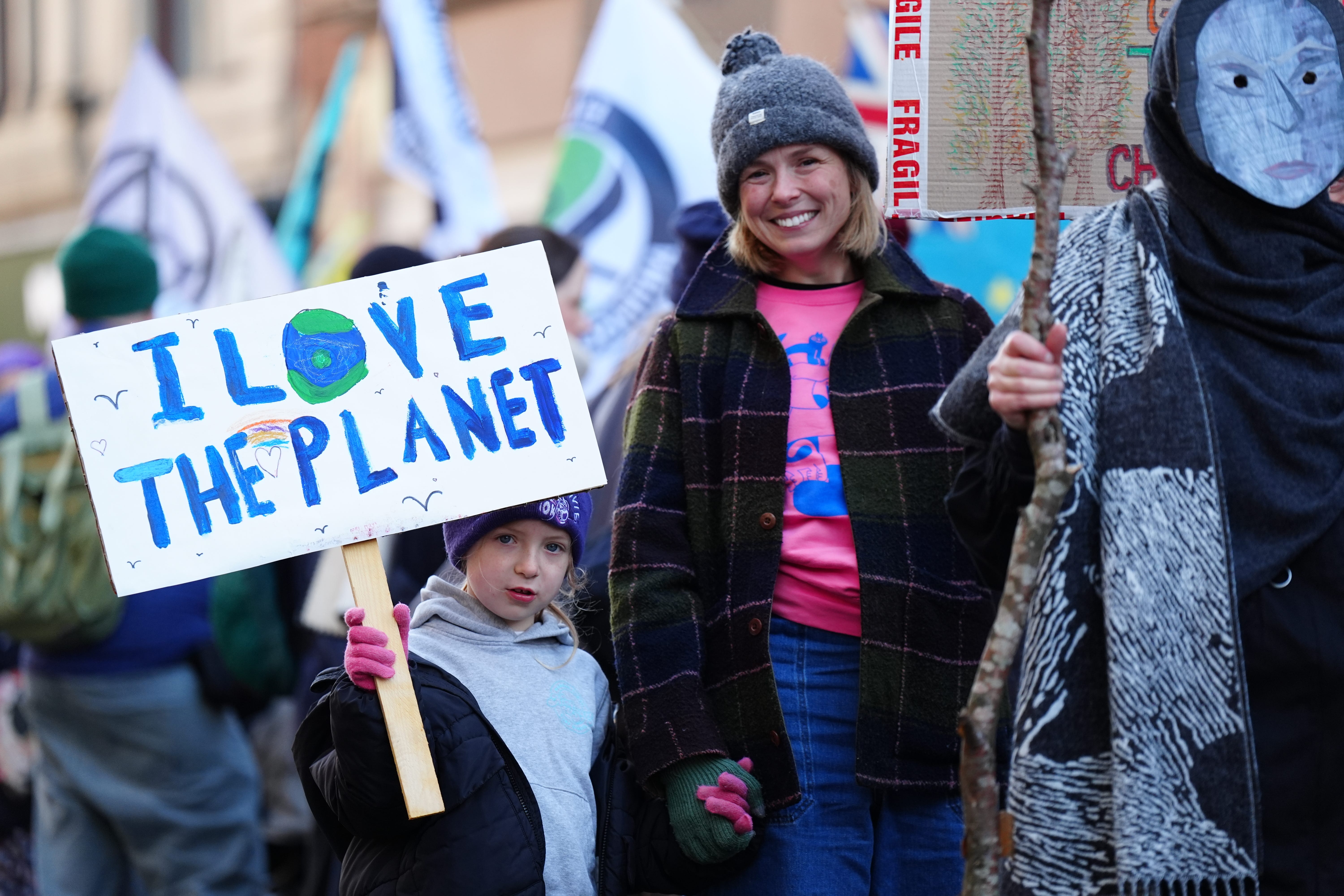 People take part during a climate march in Glasgow (Jane Barlow/PA)