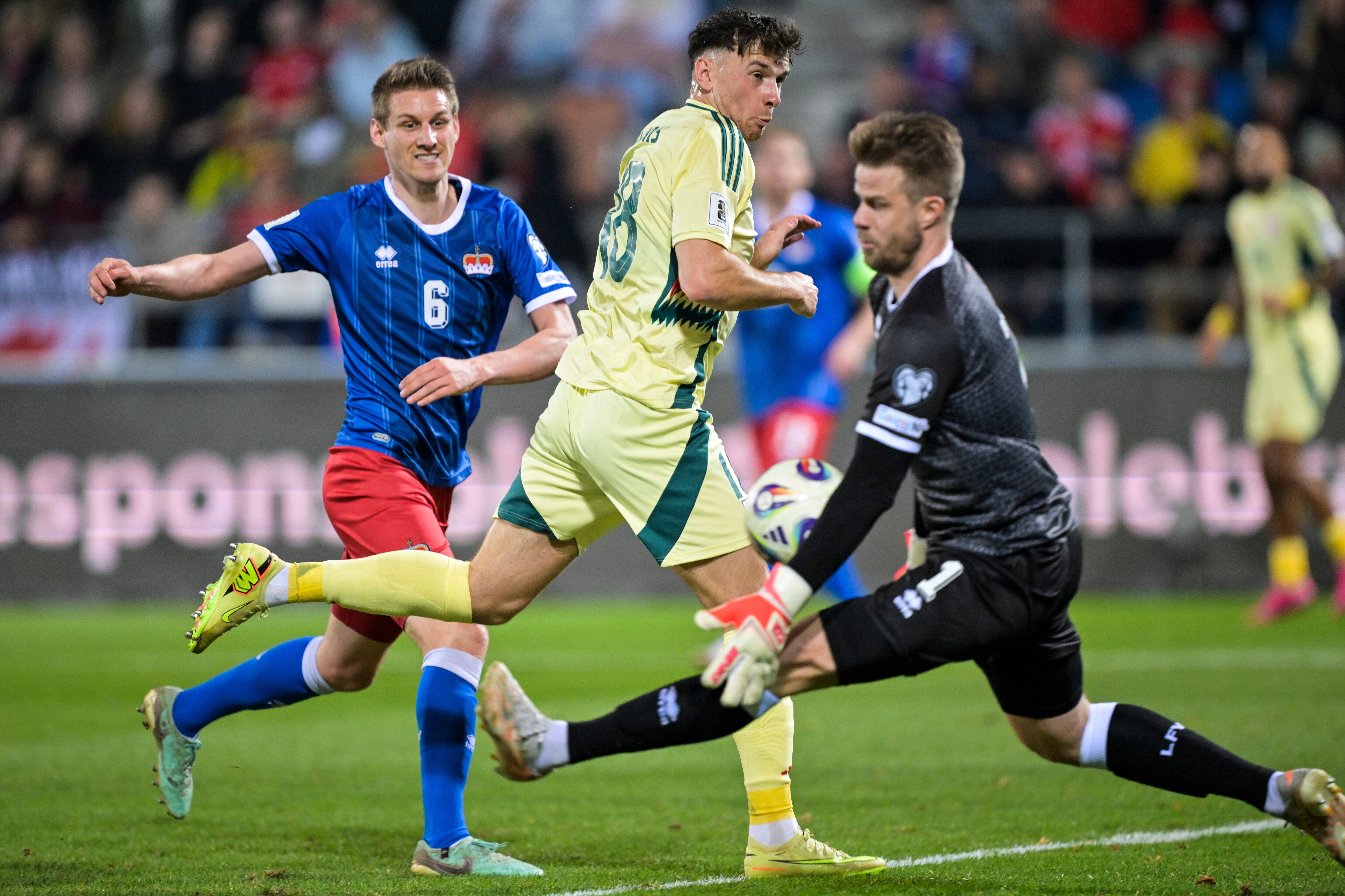 Wales striker Mark Harris closes in on the Liechtenstein goal (Gian Ehrenzeller/Keystone via AP)