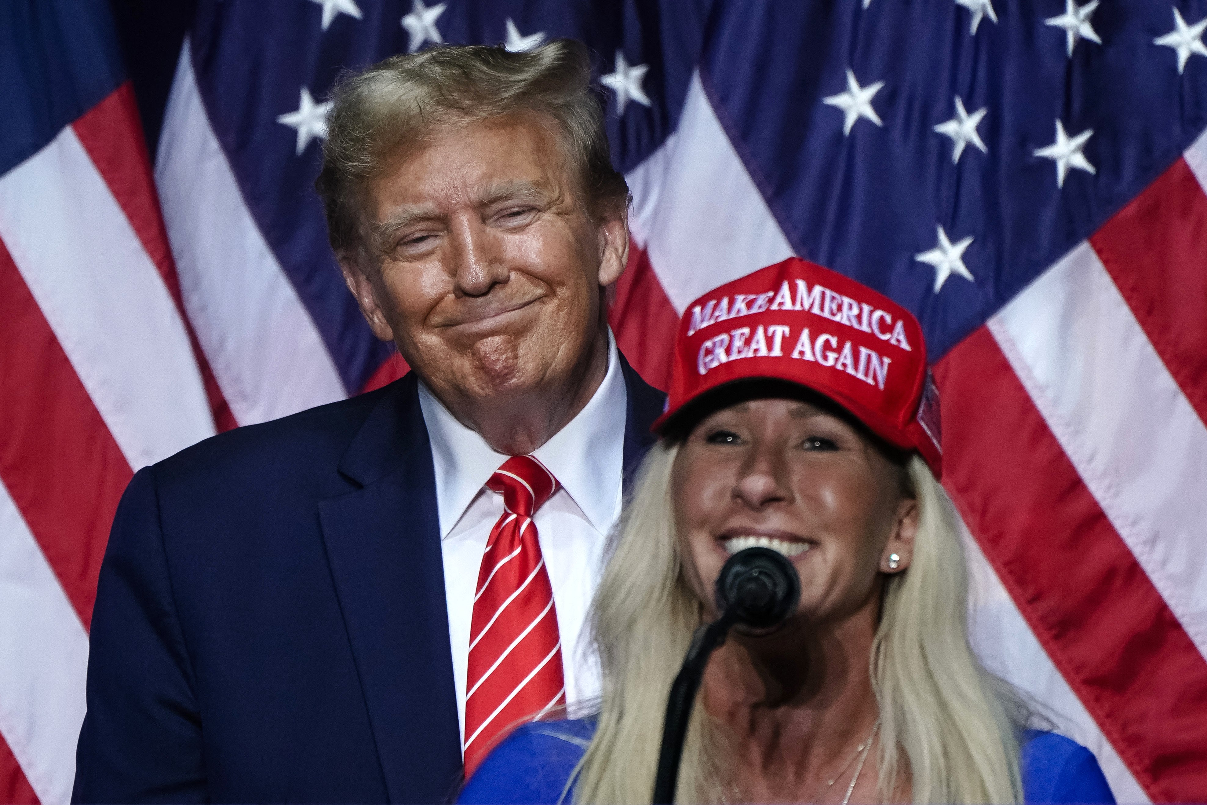 Happier times: Trump and Taylor Greene on the campaign trail in 2024