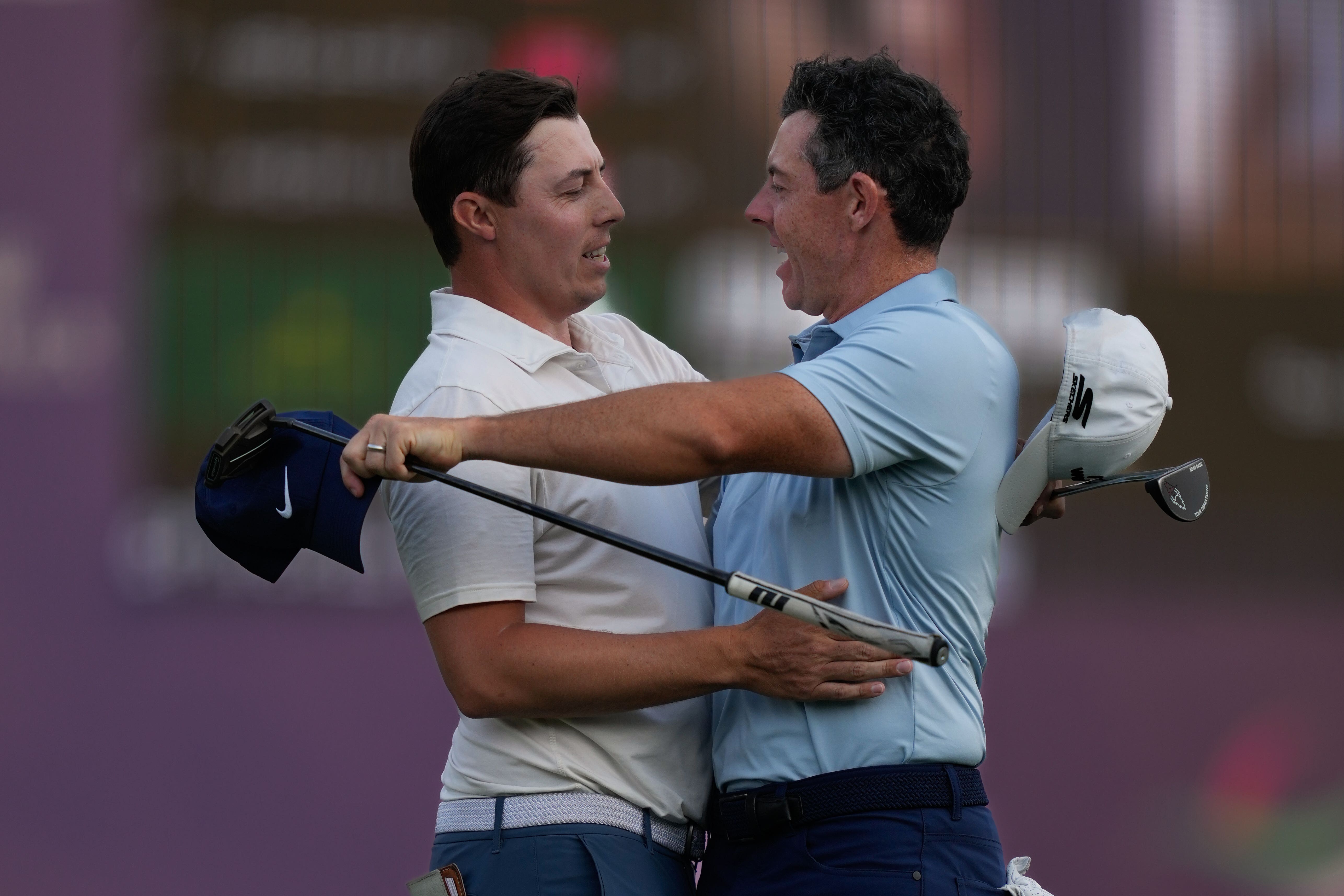 Rory McIlroy (right) was edged out in a play-off by Matt Fitzpatrick in Dubai (Altaf Qadri/AP).