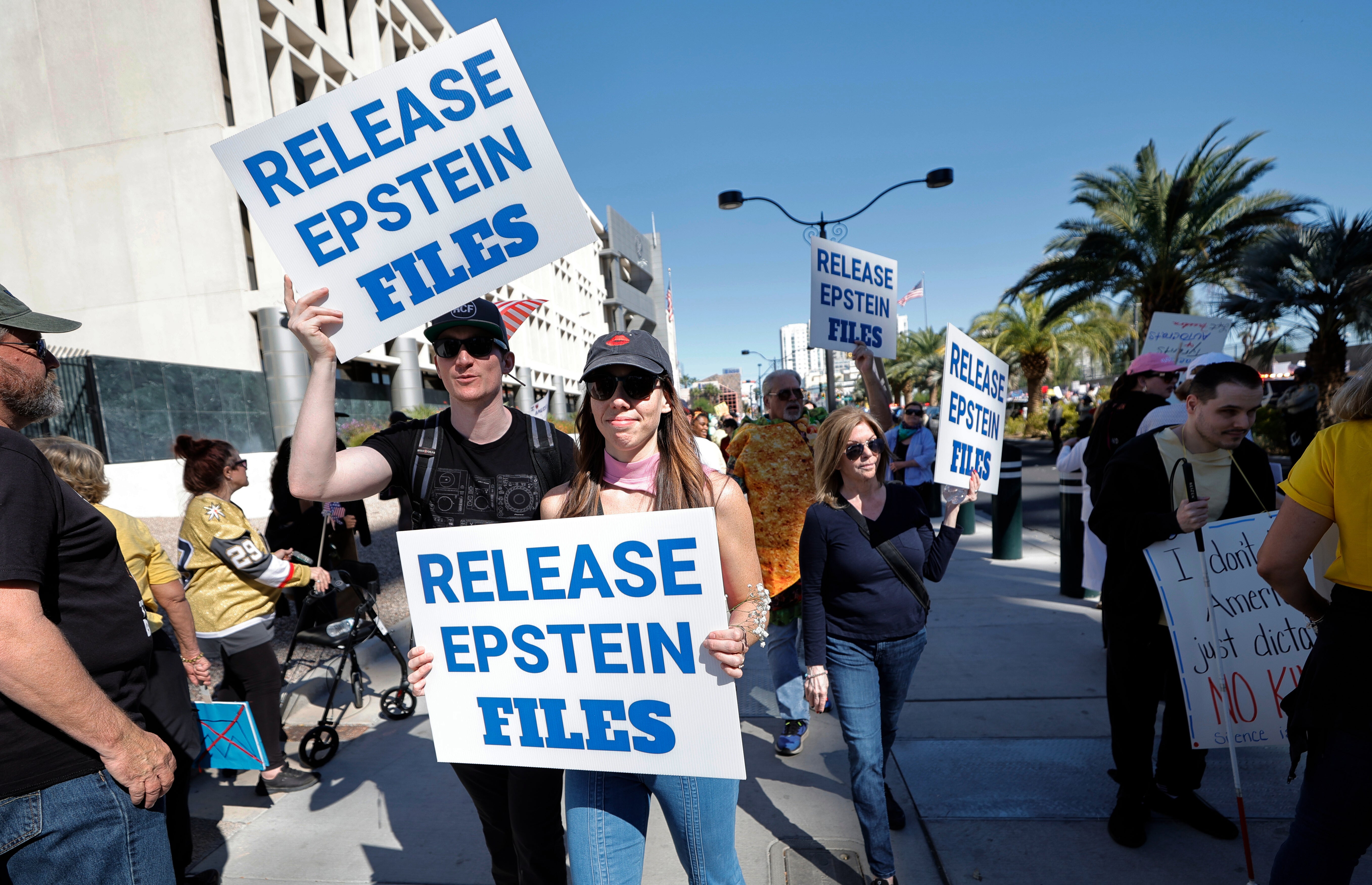 Protesters calling for the release of the Epstein files. Donald Trump allegedly called Jeffrey Epstein moments after his 2016 election victory over Hillary Clinton, contrary to his later claims he had not spoken to the pedophile financier in years, his brother has said