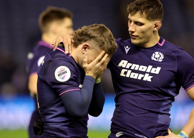 <p>Scotland's Darcy Graham is consoled by Rory Darge after the defeat</p>