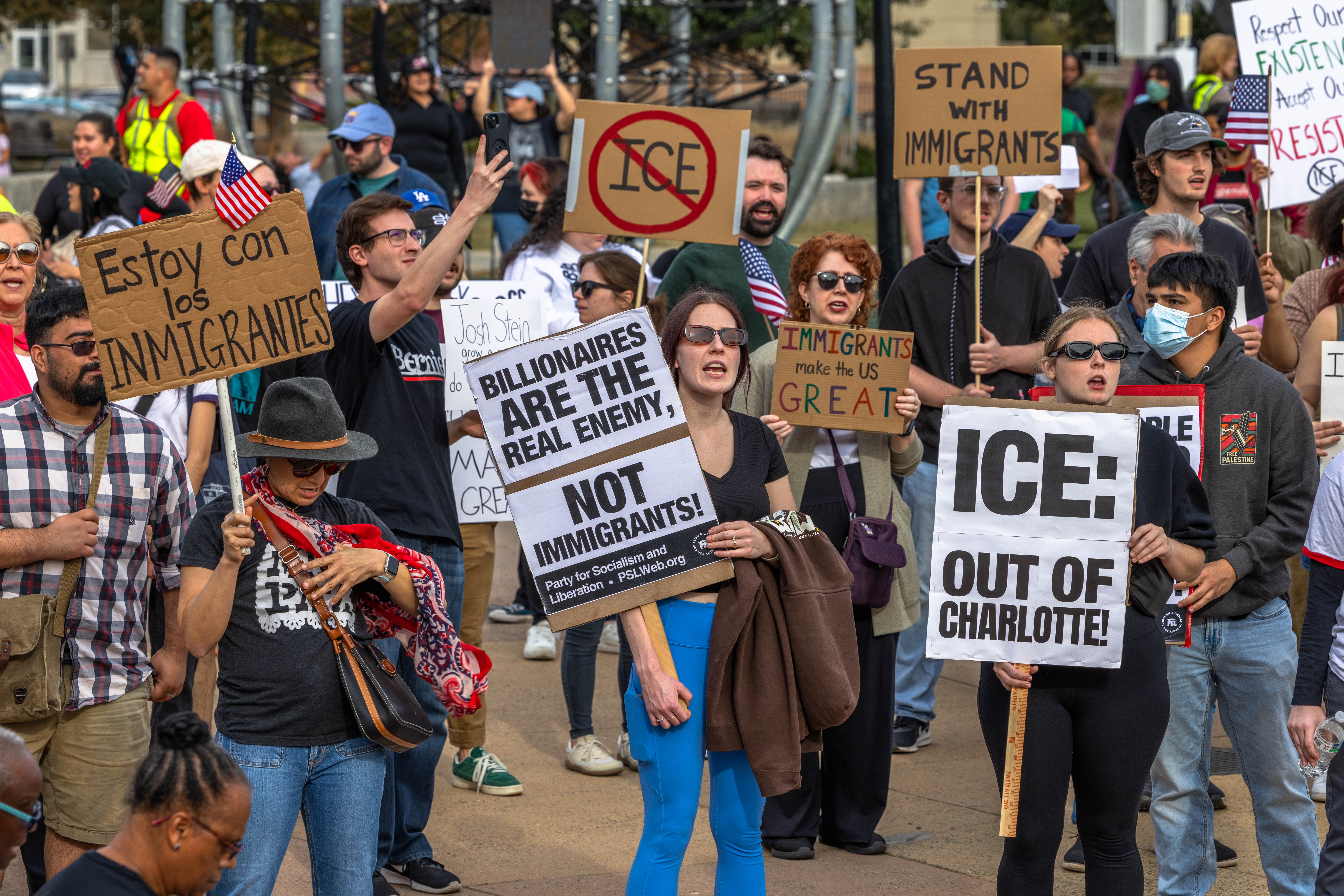 Demonstrators in Charlotte marched against federal agents surging into the city as border patrol officers arrested dozens of people within its first day of operations.