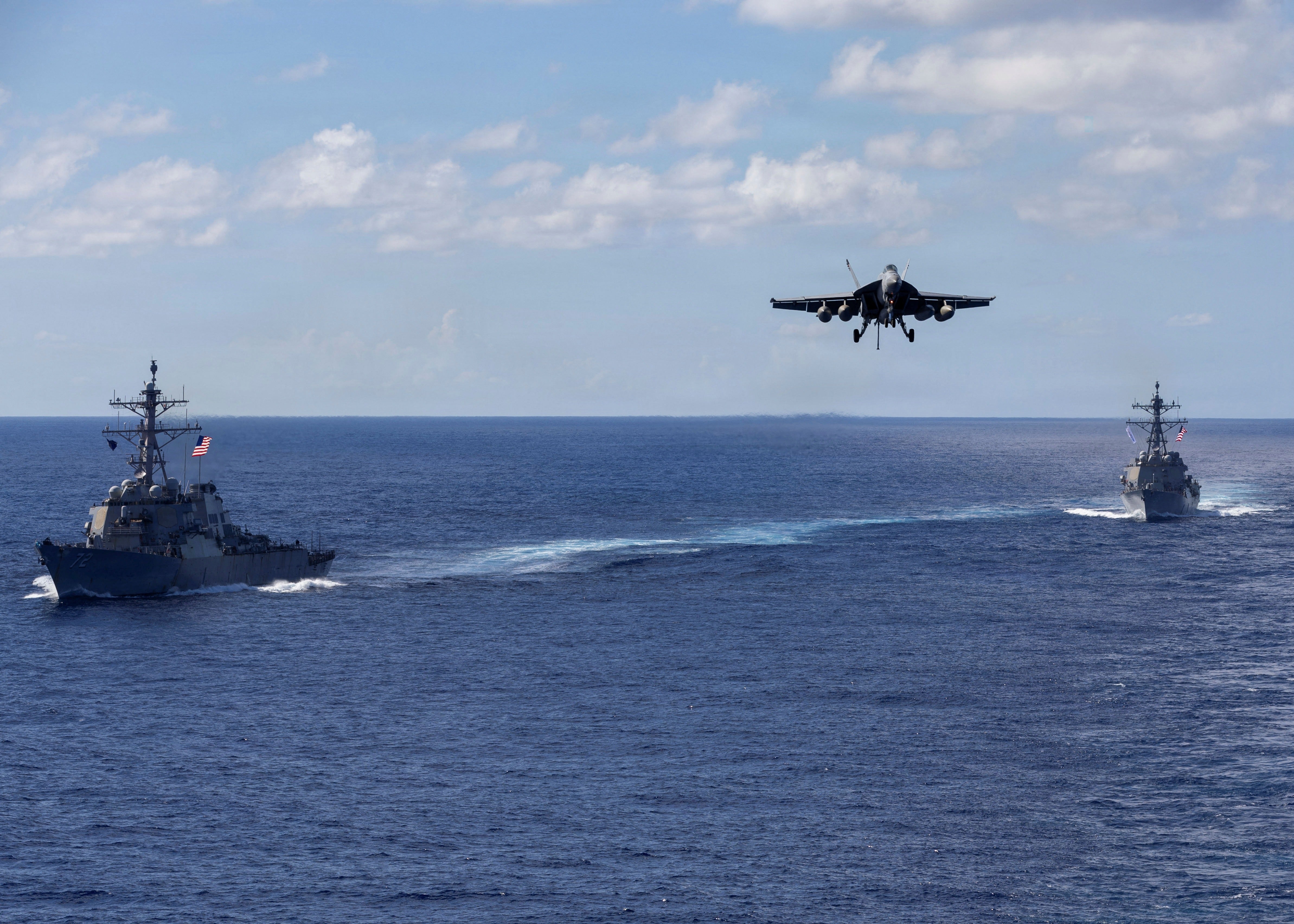The Arleigh Burke-class guided-missile destroyers USS Mahan (DDG 72), left, and USS Bainbridge (DDG 96) sailing in formation
