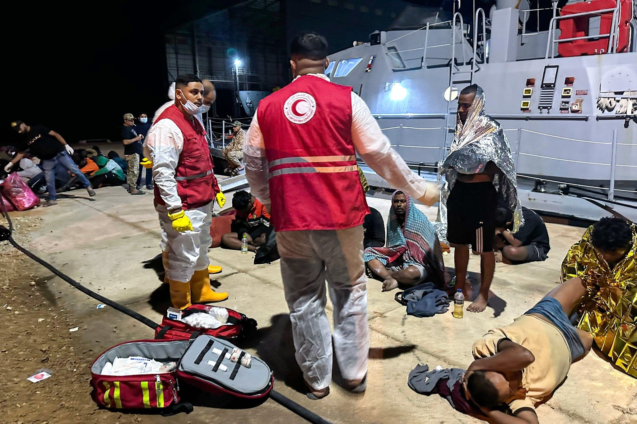 At least four people were killed after boats carrying migrants capsized off the Libyan coast