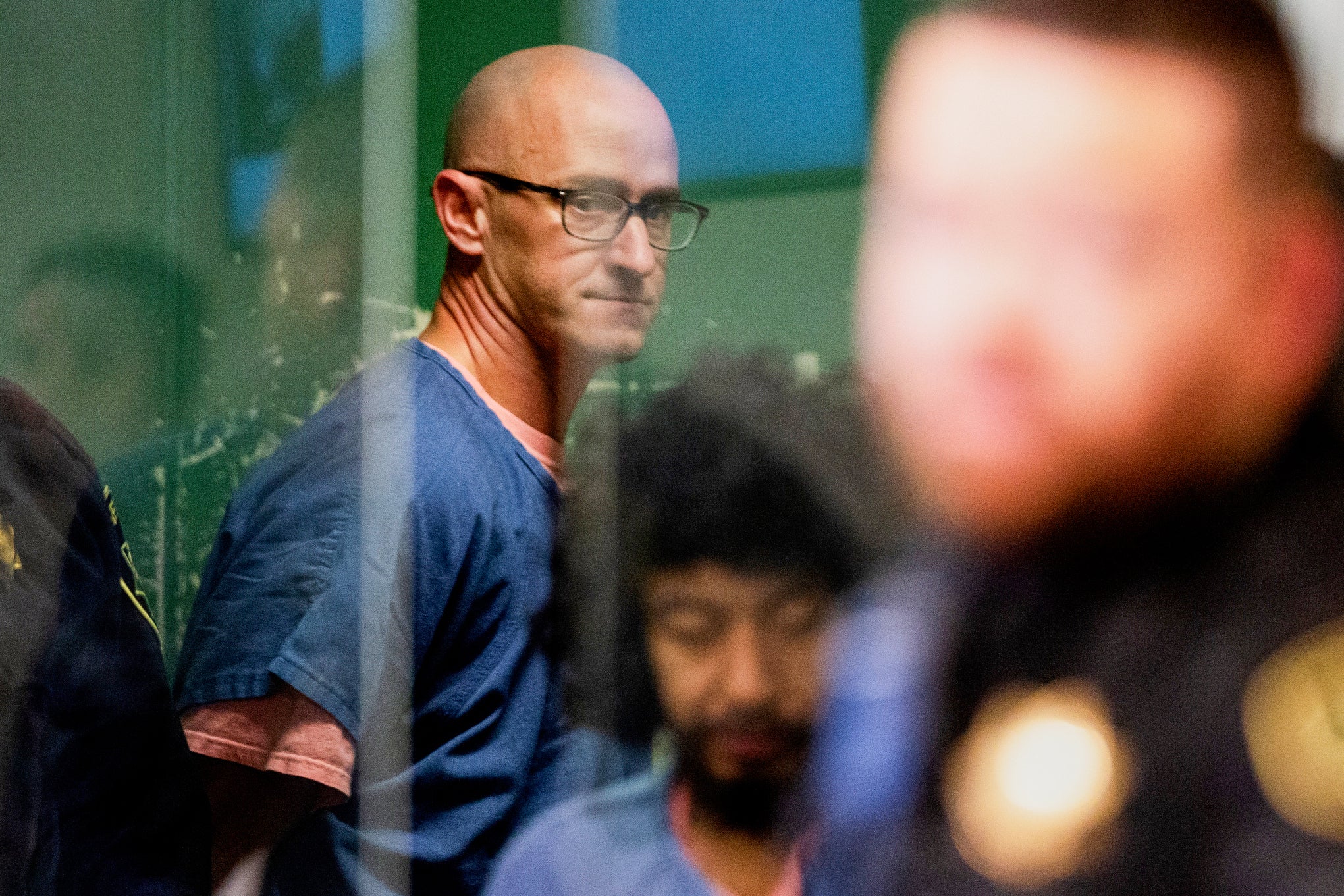 Joseph David Emerson, back, appears in Multnomah County Circuit Court for an indictment hearing in Portland, Ore., on Dec. 7, 2023. (Dave Killen/The Oregonian via AP, Pool, File)