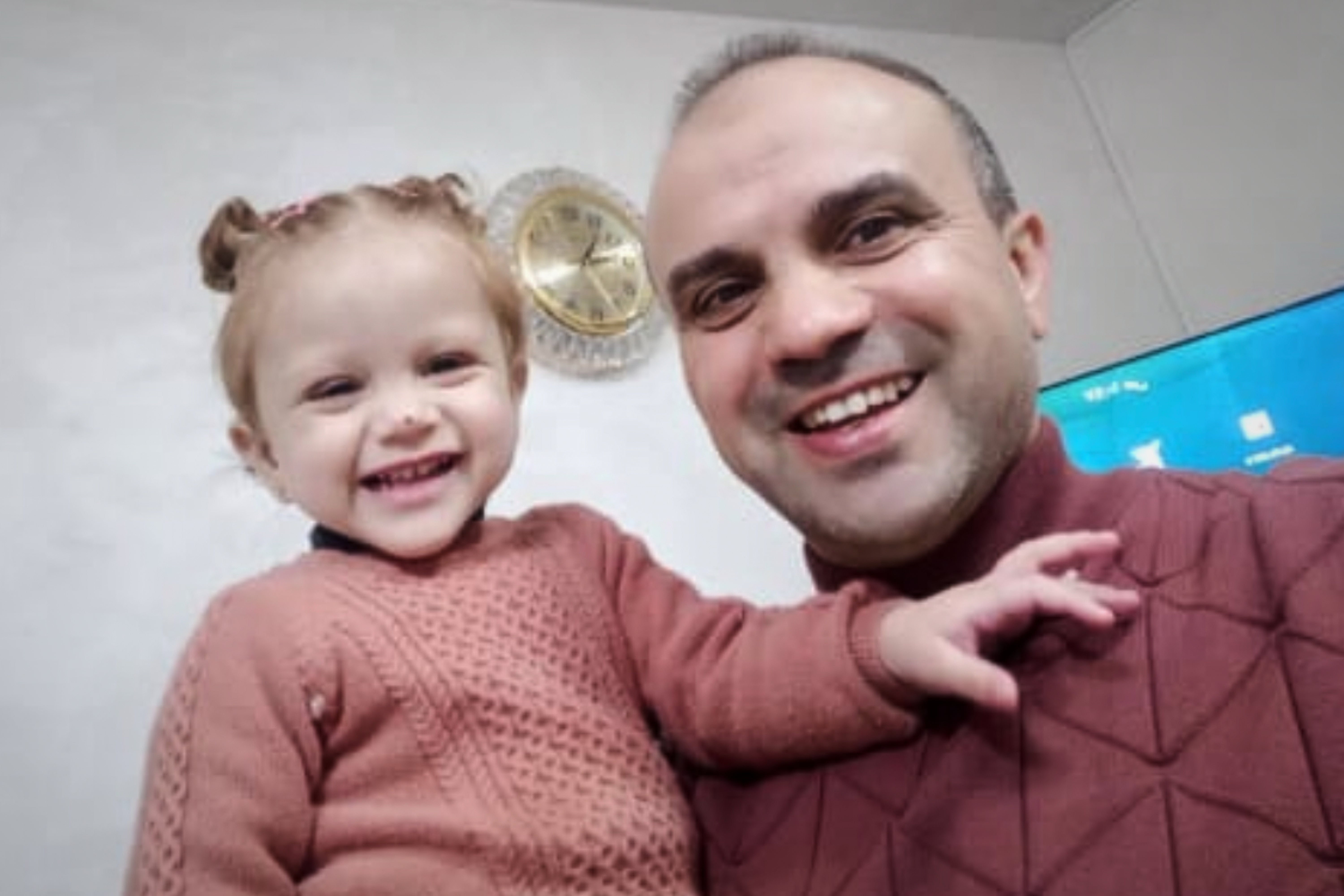 In this undated photo provided by his family, Mohammad Husein Ali, 45, holds his daughter, Misk, shortly before he was detained and died in Israeli custody at the Kishon detention center. (Ali family via AP)