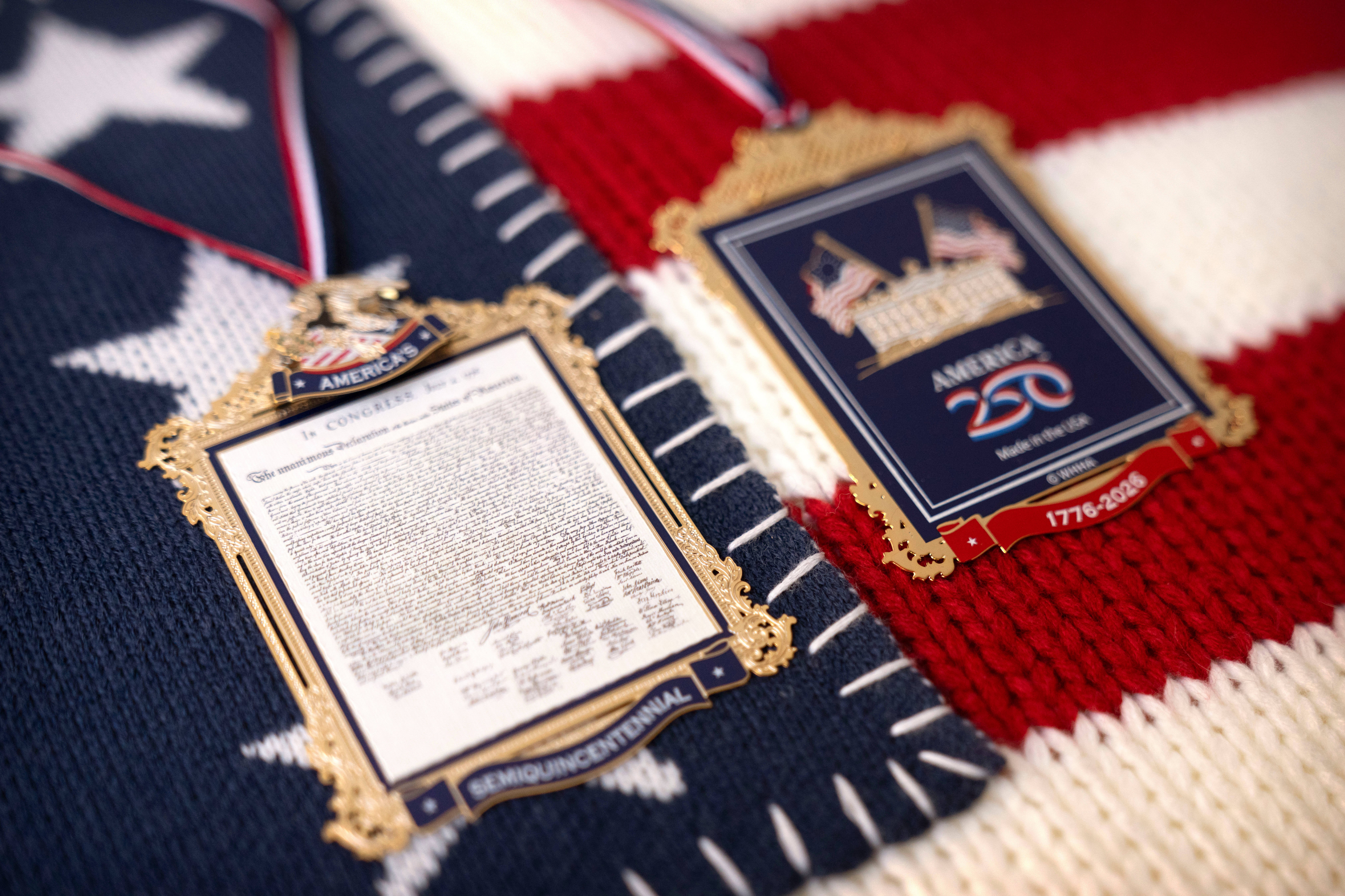 The front and back of a commemorative ornament released by America250 as part of events leading up to the 250th anniversary of the signing of the Declaration of Independence in 1776, is photographed Thursday, Nov. 13, 2025, in Washington