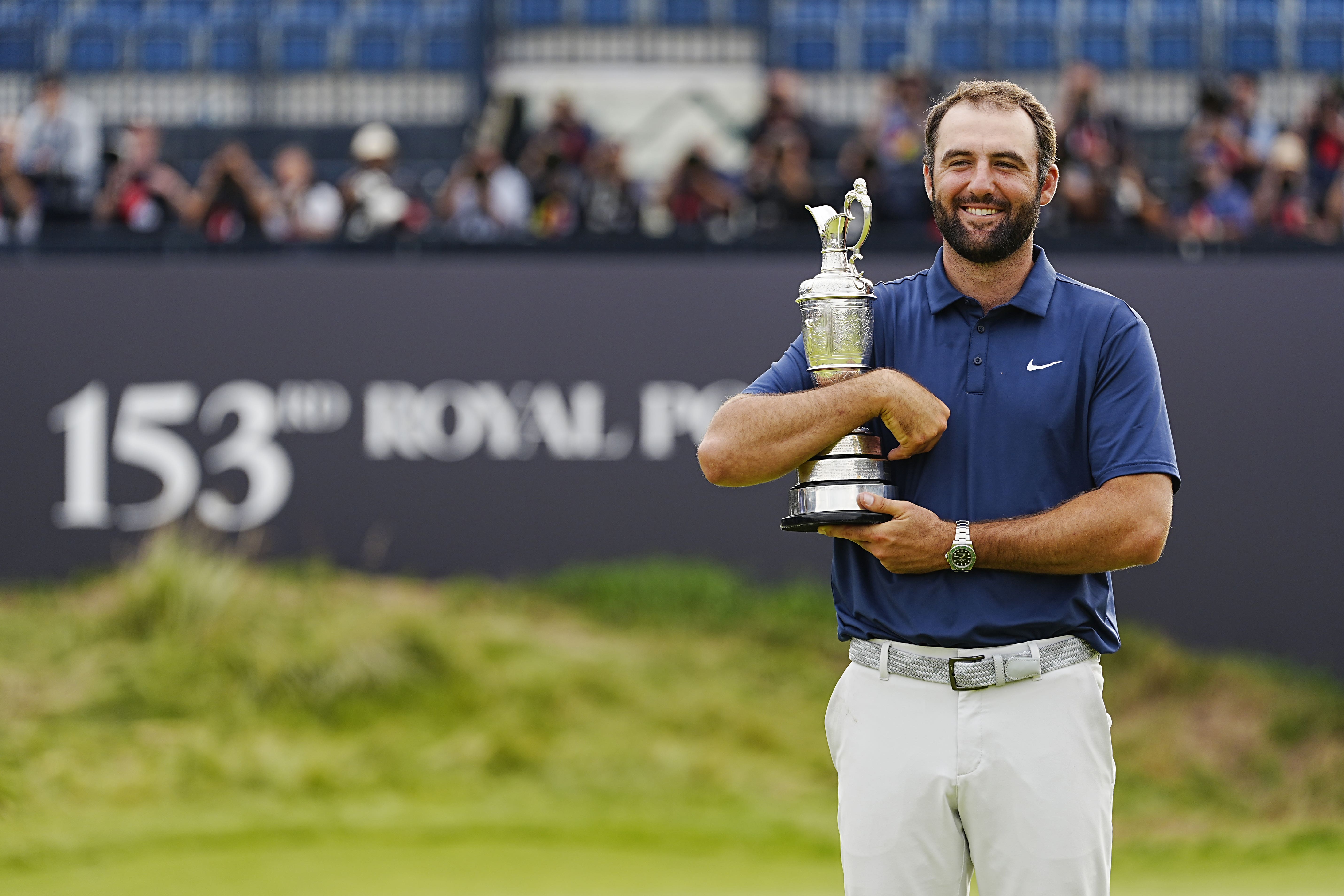 Scottie Scheffler celebrates with the Claret Jug after winning the 153rd Open Championship at Royal Portrush (Peter Byrne/PA)