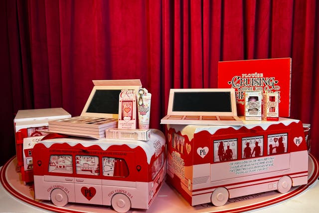 <p>The viral calendar is split across four Christmas-wrapped vehicles</p>