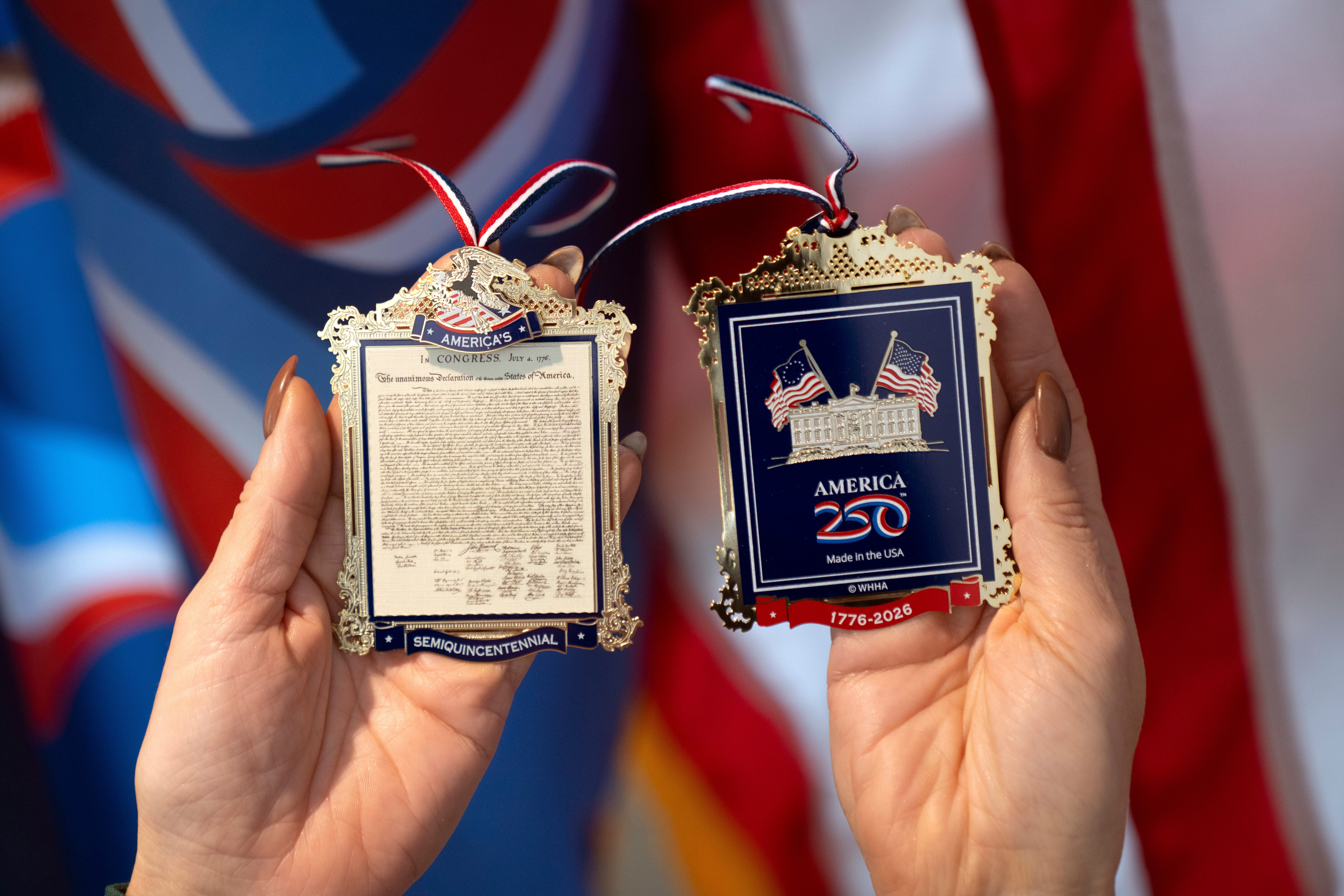 The front and back of a commemorative ornament released by America250 as part of events leading up to the 250th anniversary of the signing of the Declaration of Independence in 1776, Thursday, Nov. 13, 2025, in Washington
