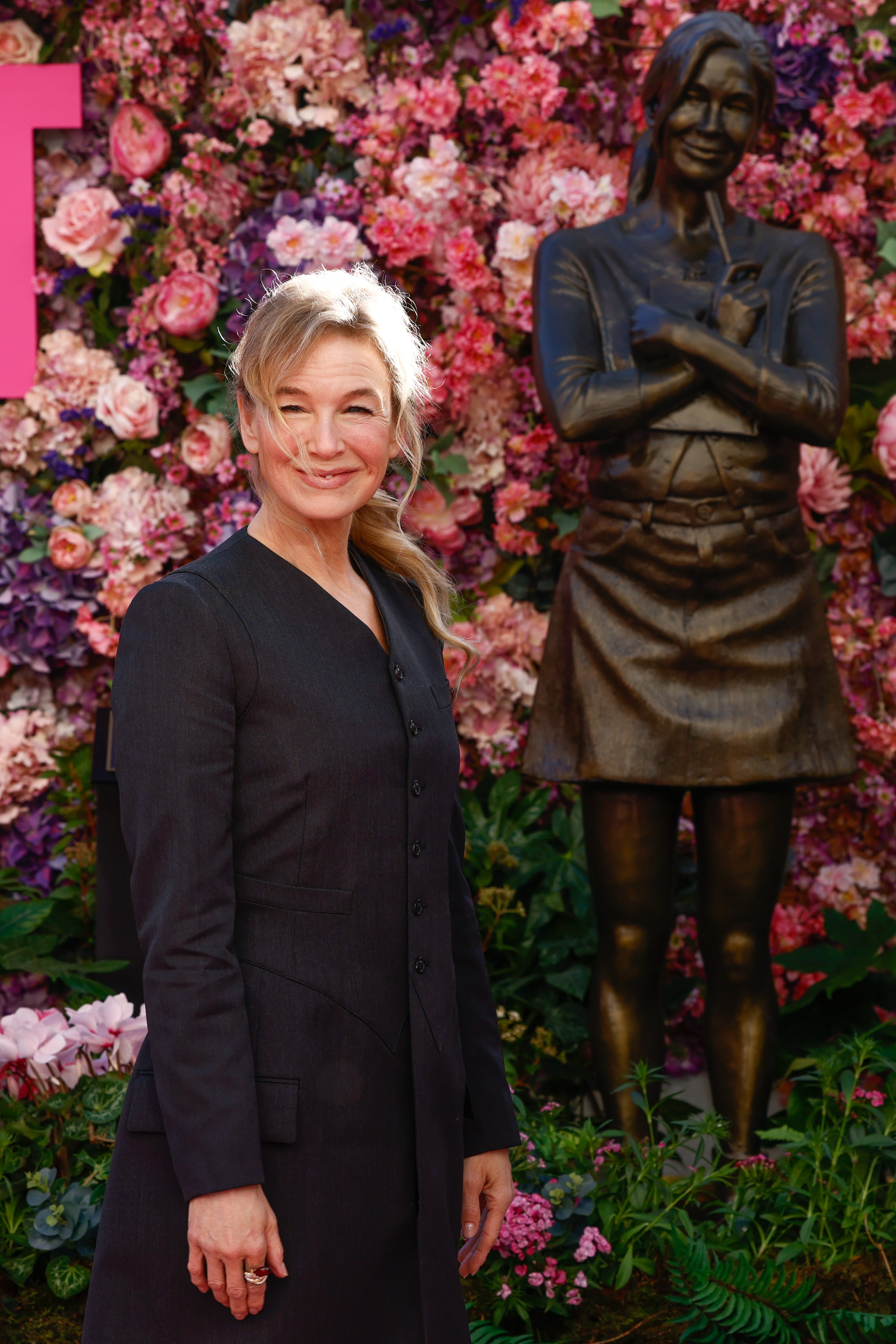 Renee Zellweger poses for photographers during the unveiling of the Bridget Jones statue